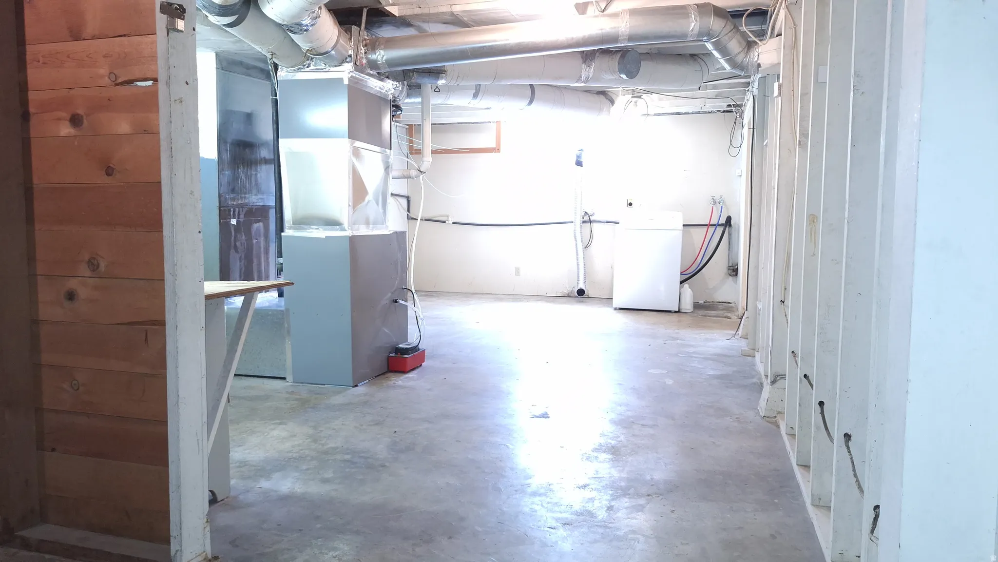 Large unfinished space adjacent to bedroom