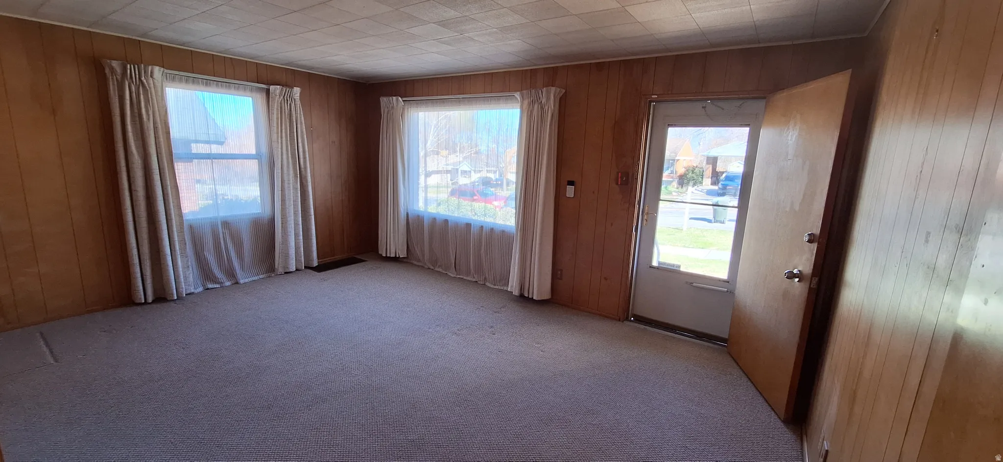 Large living room windows give open feel