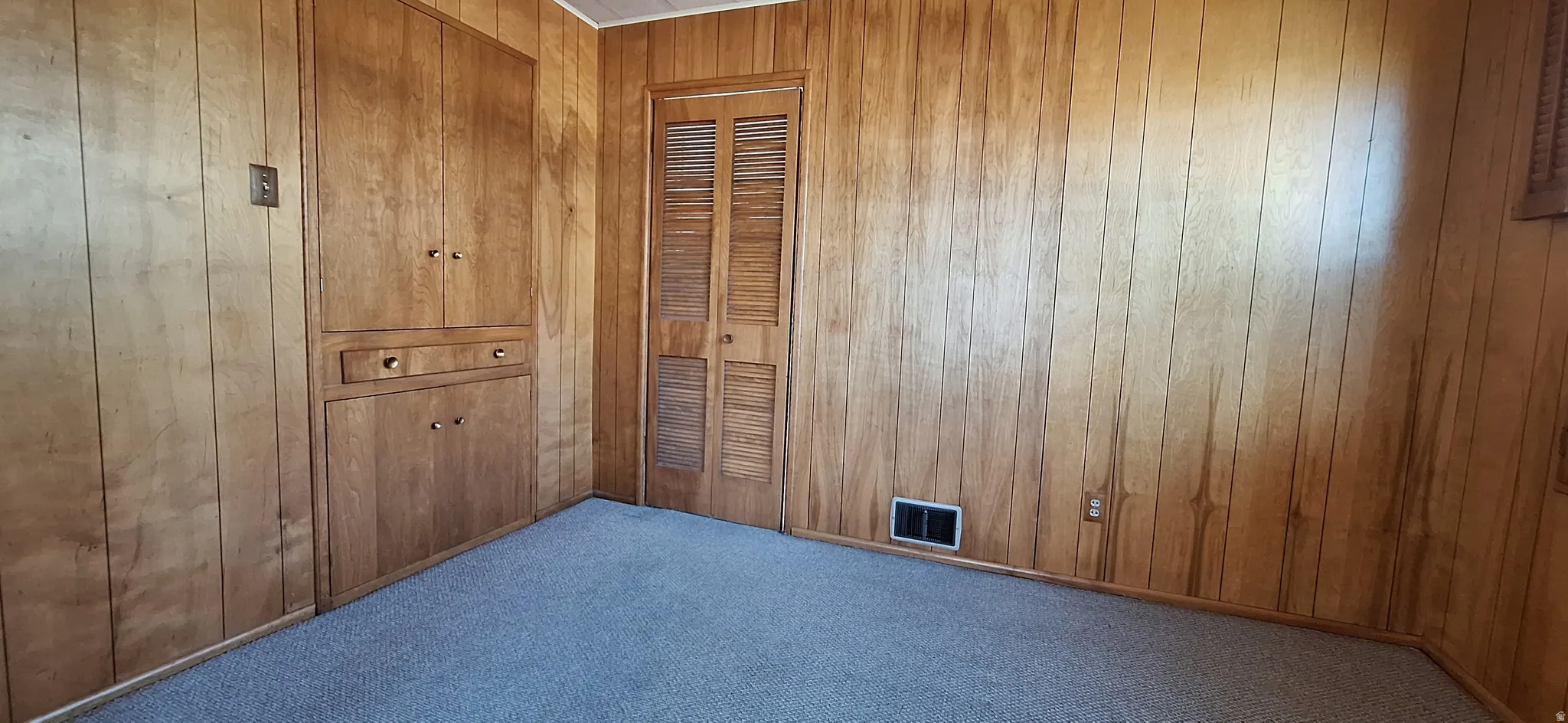 Dining room has 1950s era built in shelving