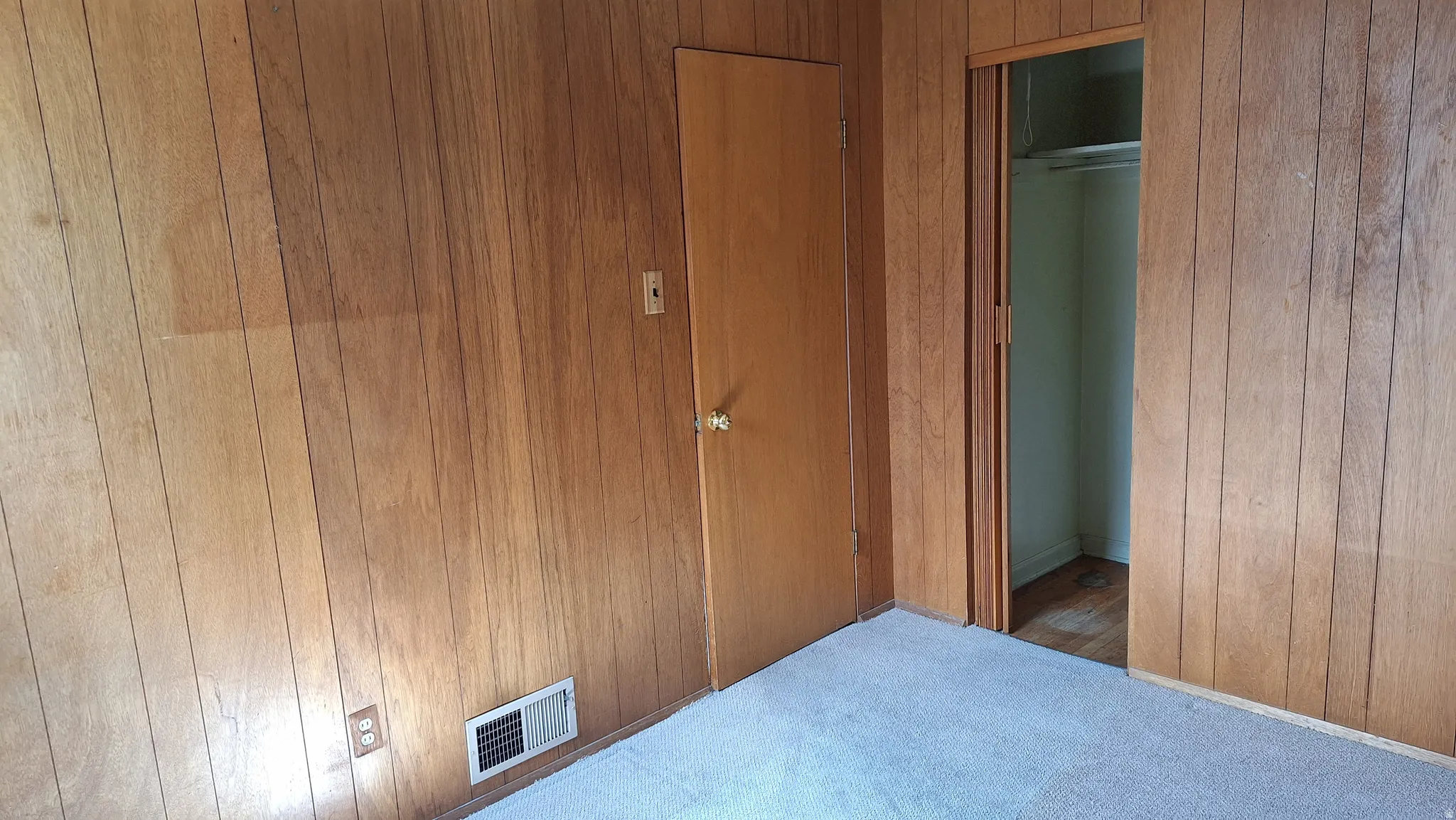 Southeast bedroom entry door and closet