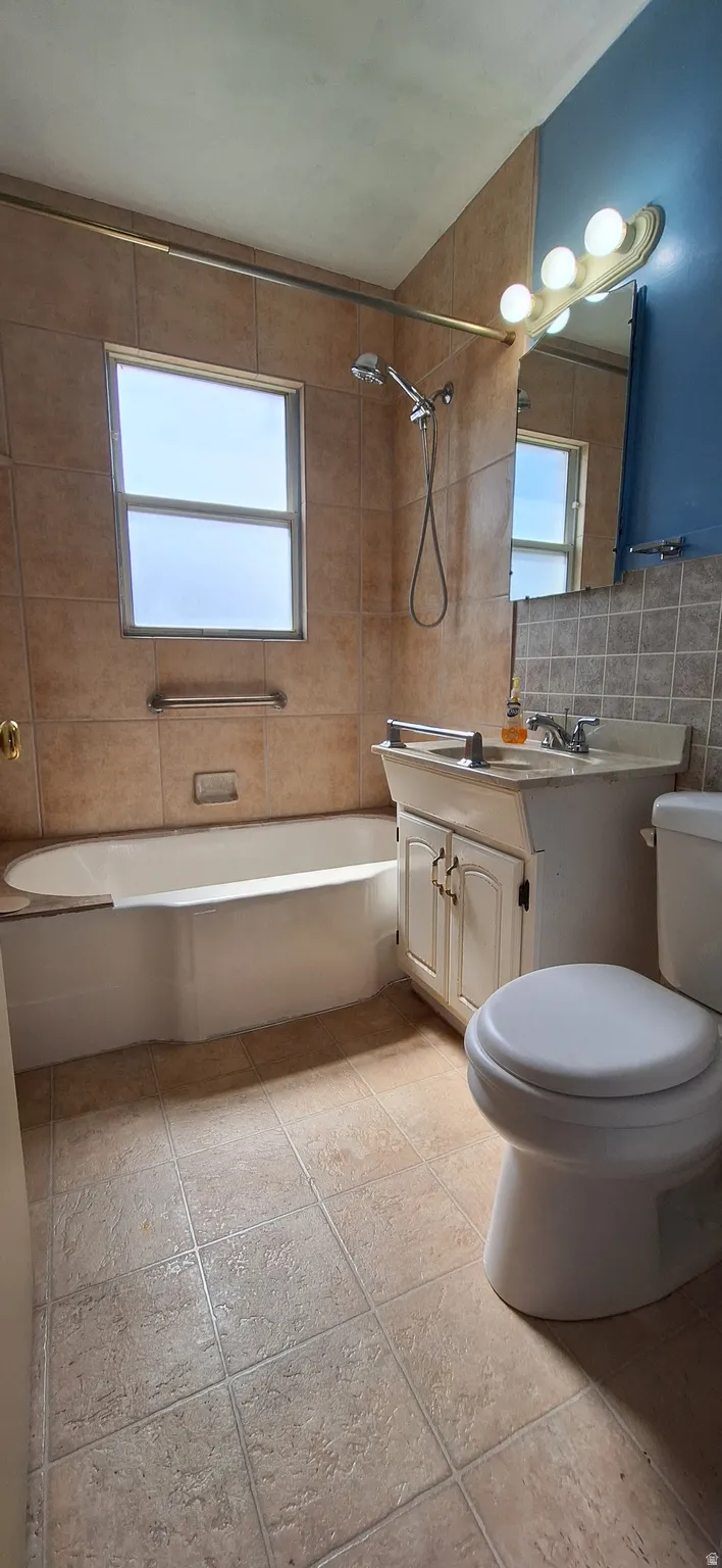 Bathroom features large, deep porcelain tub