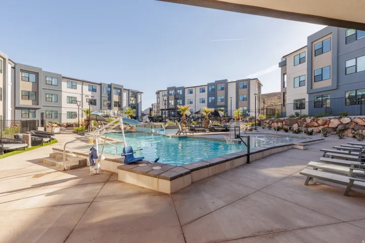 Outdoor community pool featuring a patio area