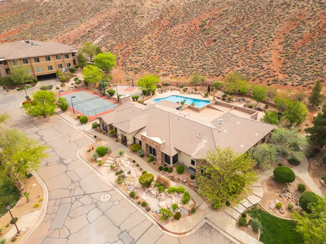 View from above of property featuring a pool and a desert landscape