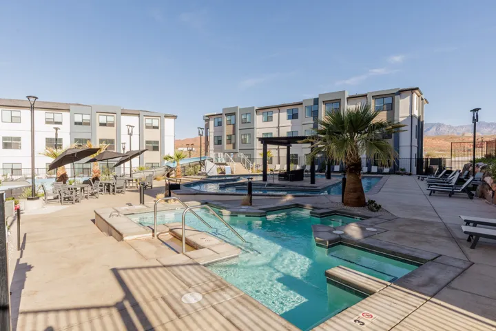 Community pool with a community hot tub, a patio, and a mountain view