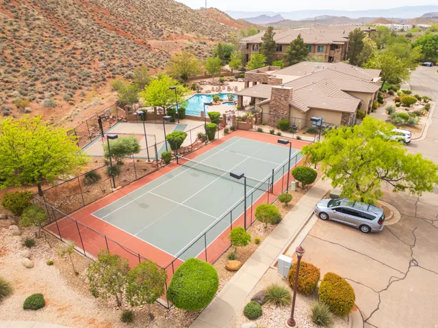 pickleball court with a mountain view and a community pool