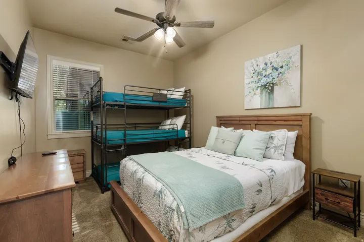 Bedroom 2 featuring carpet flooring and ceiling fan
