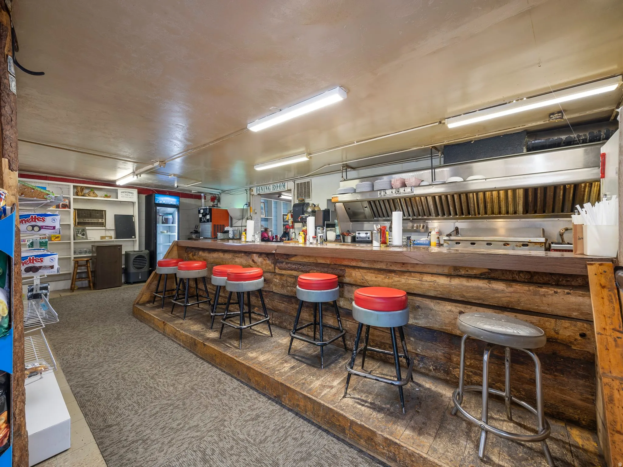 Kitchen featuring a kitchen breakfast bar and wooden counters