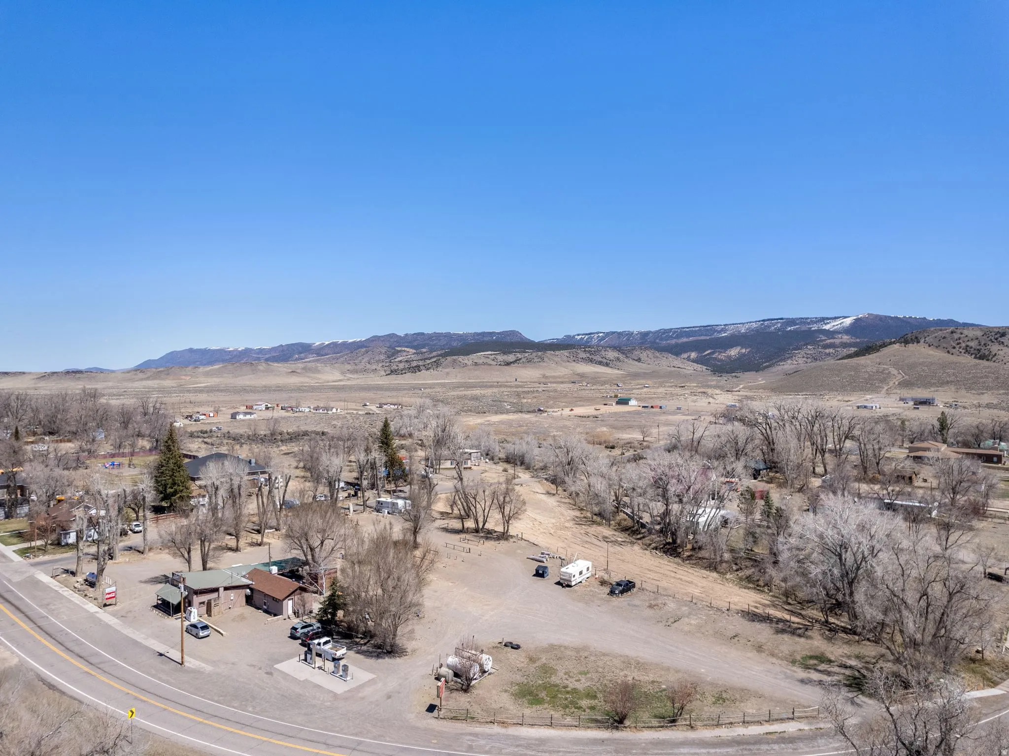 View of mountain backdrop with rural landscape