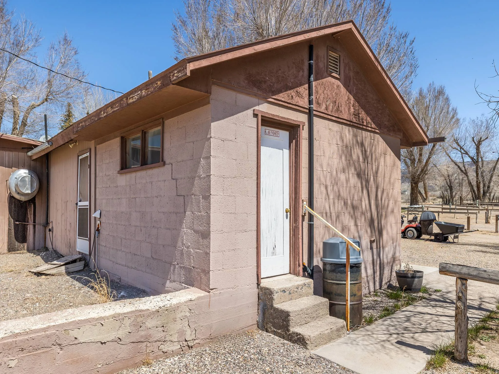 View of side of home featuring concrete block siding