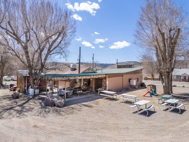 Back of property with a patio area and a mountain view