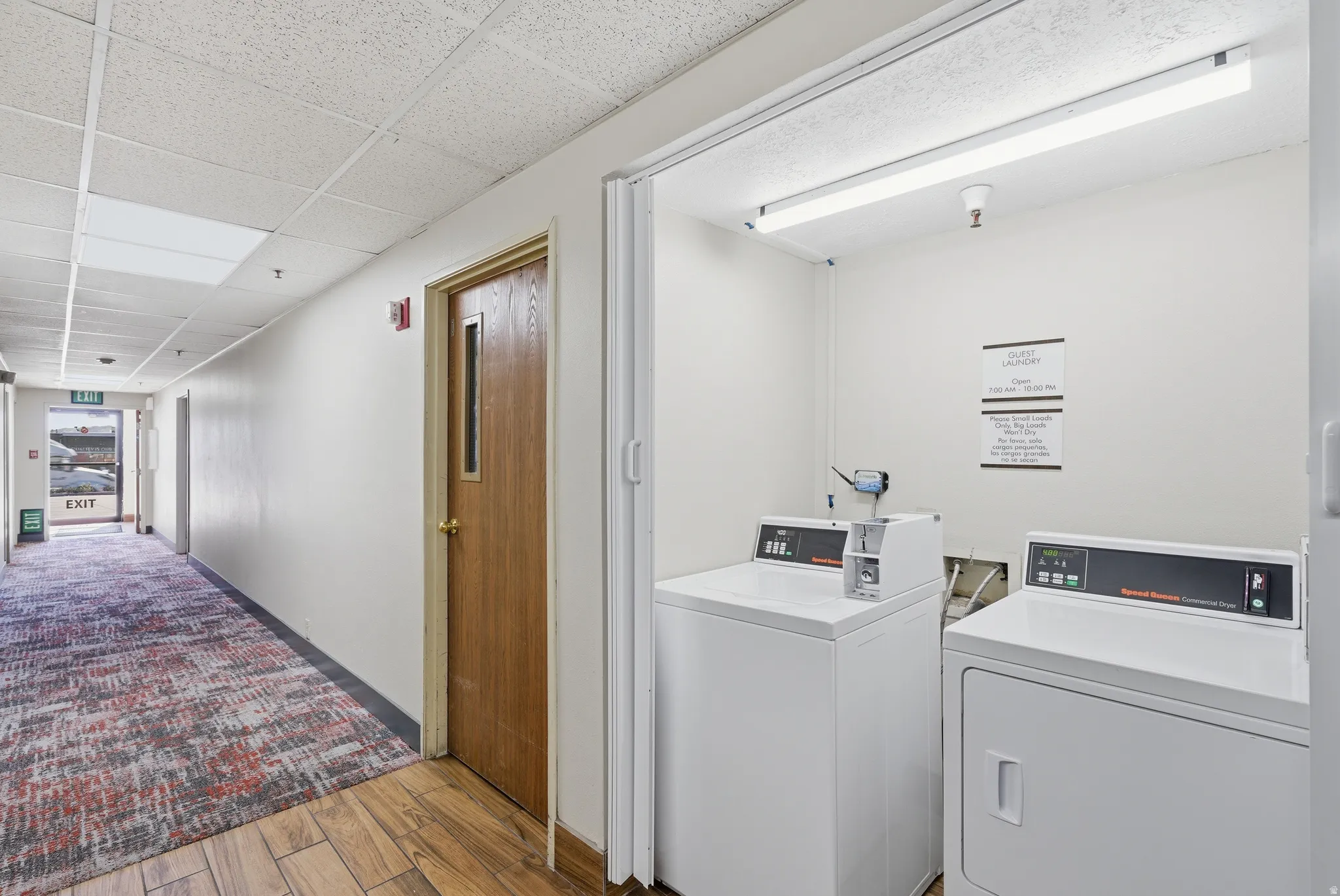 Laundry room featuring a paneled ceiling and washer and dryer