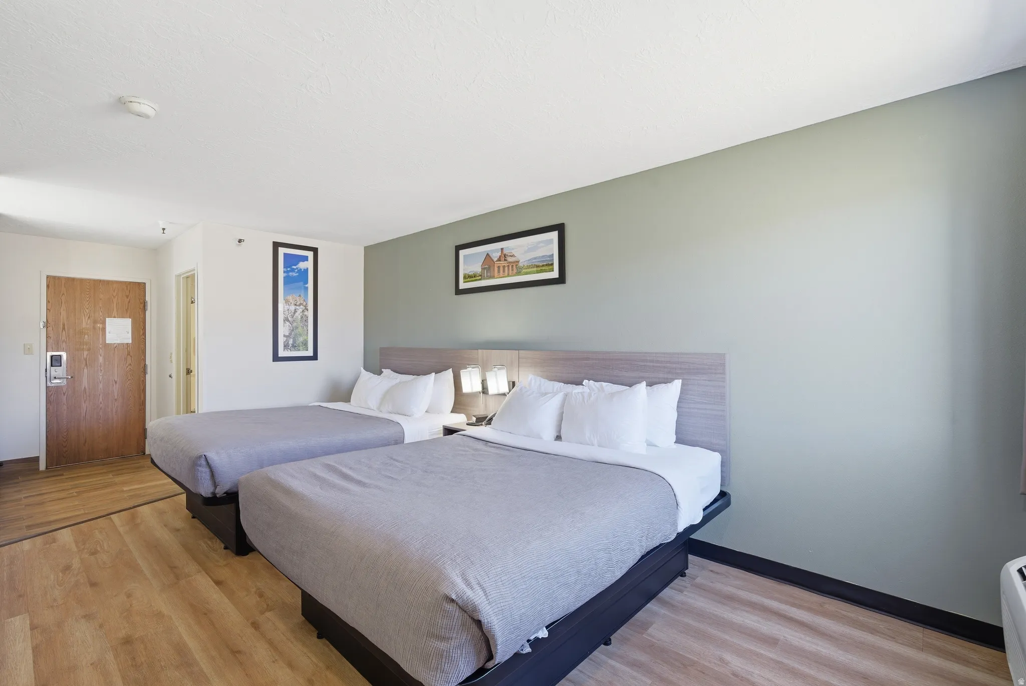 Bedroom with light wood-style floors and baseboards