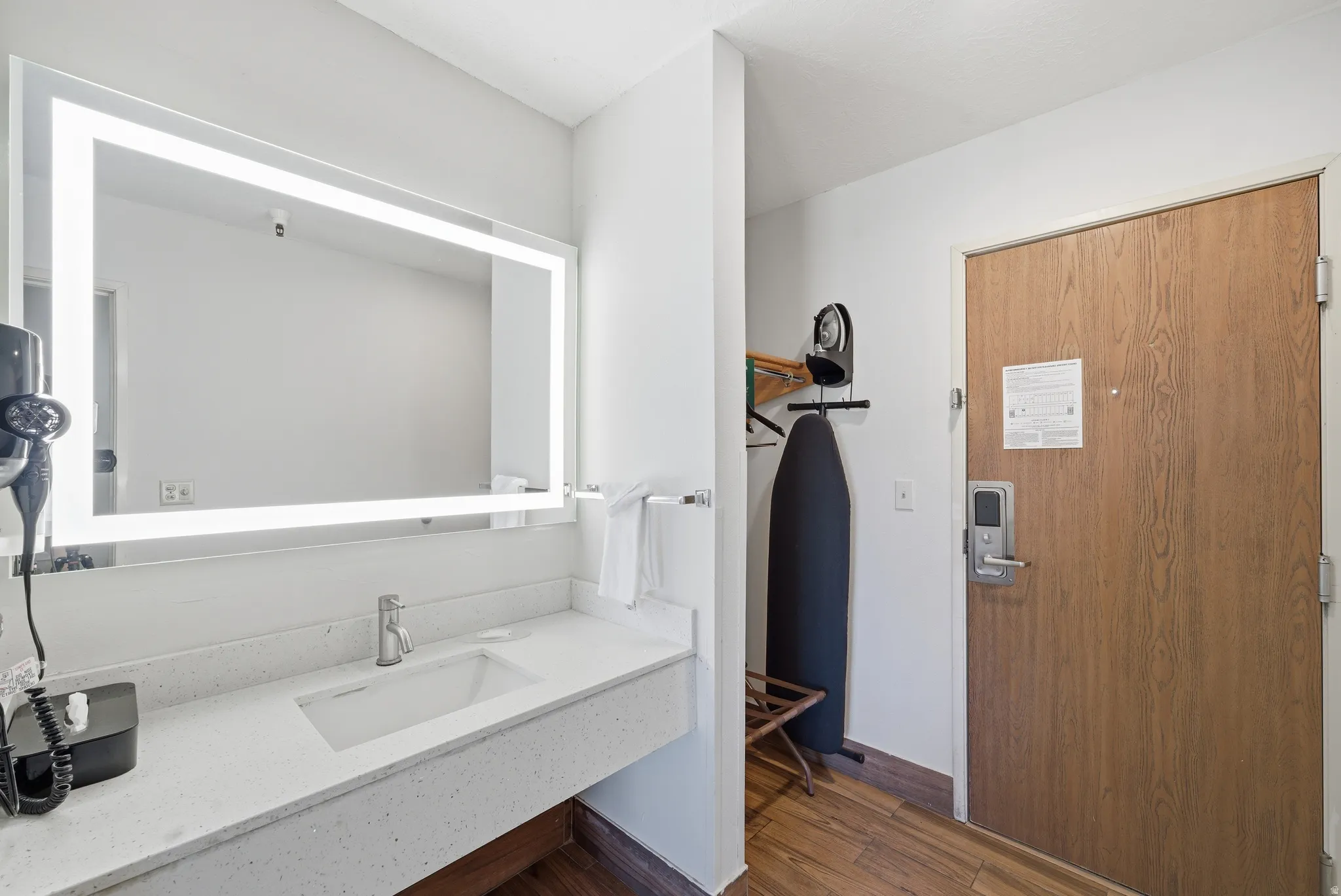 Bathroom featuring vanity and dark wood-style floors