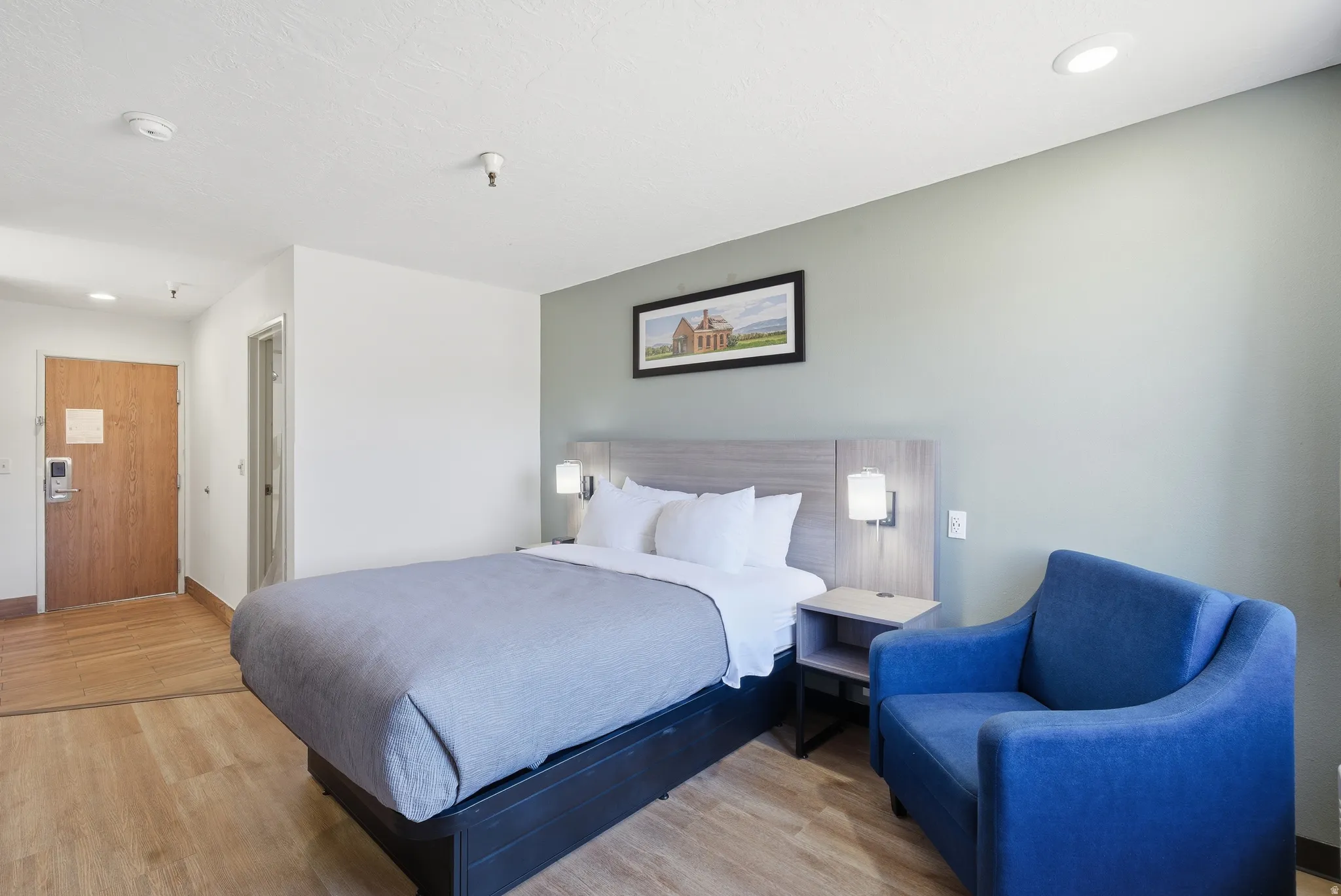 Bedroom with light wood-type flooring and recessed lighting