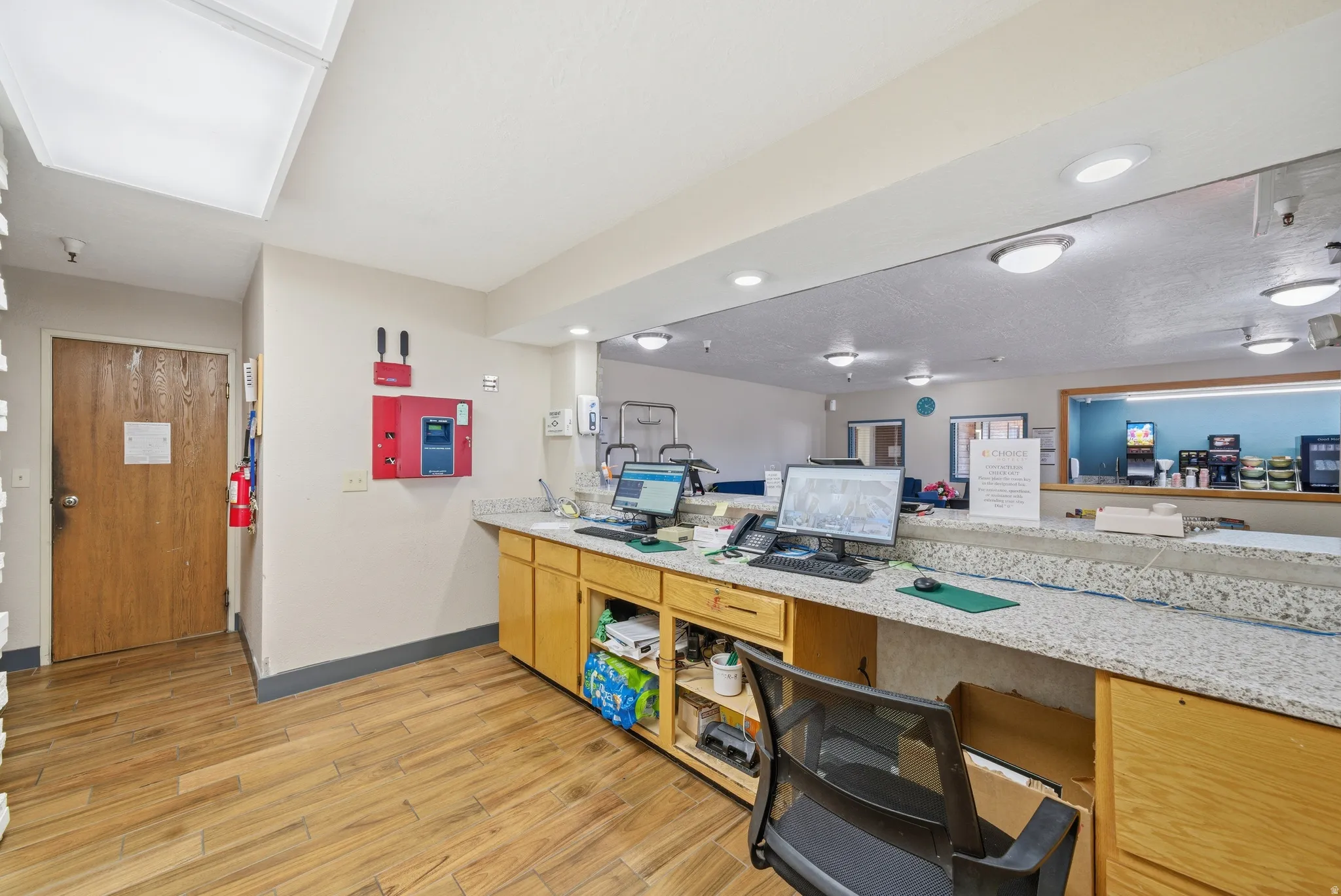 Kitchen with built in desk and light stone countertops
