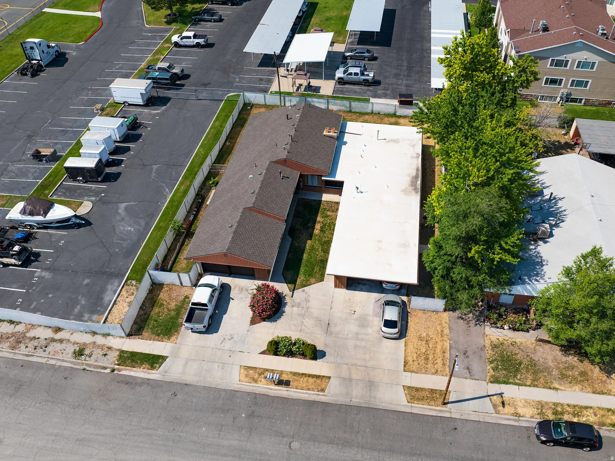 Single-story residence featuring a brown shingle roof and an attached garage