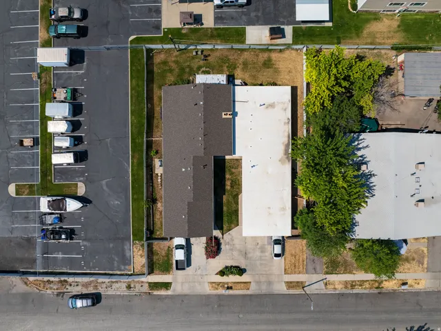 Aerial perspective highlighting two adjacent structures with distinct roofing materials