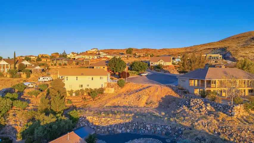 Aerial perspective of suburban area with a mountain backdrop