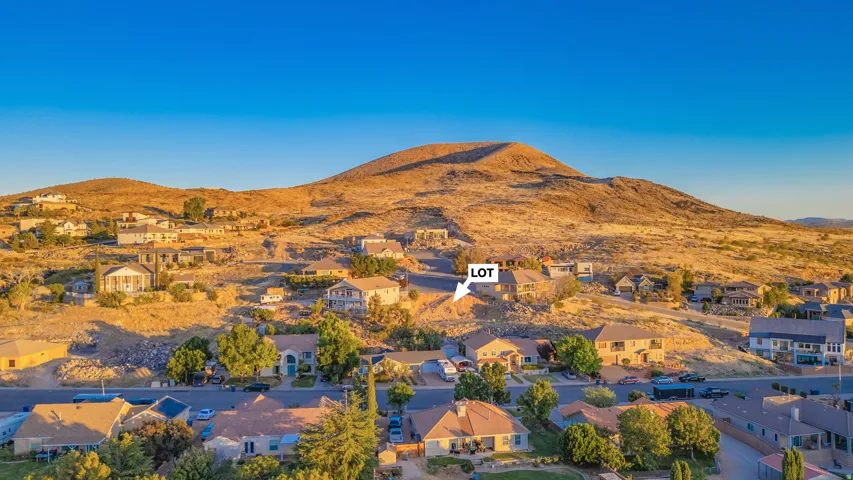 Aerial view of residential area with a mountainous background