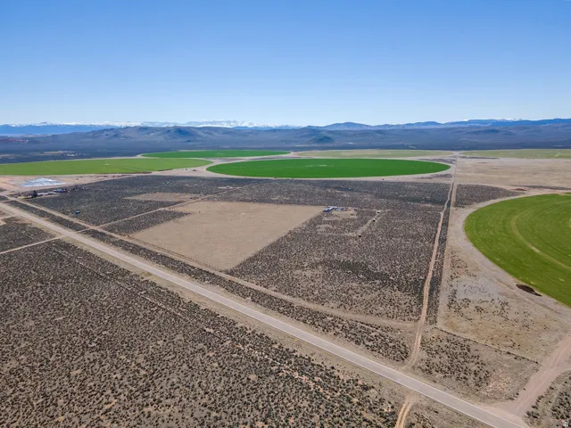 Aerial view of sparsely populated area featuring a mountainous background