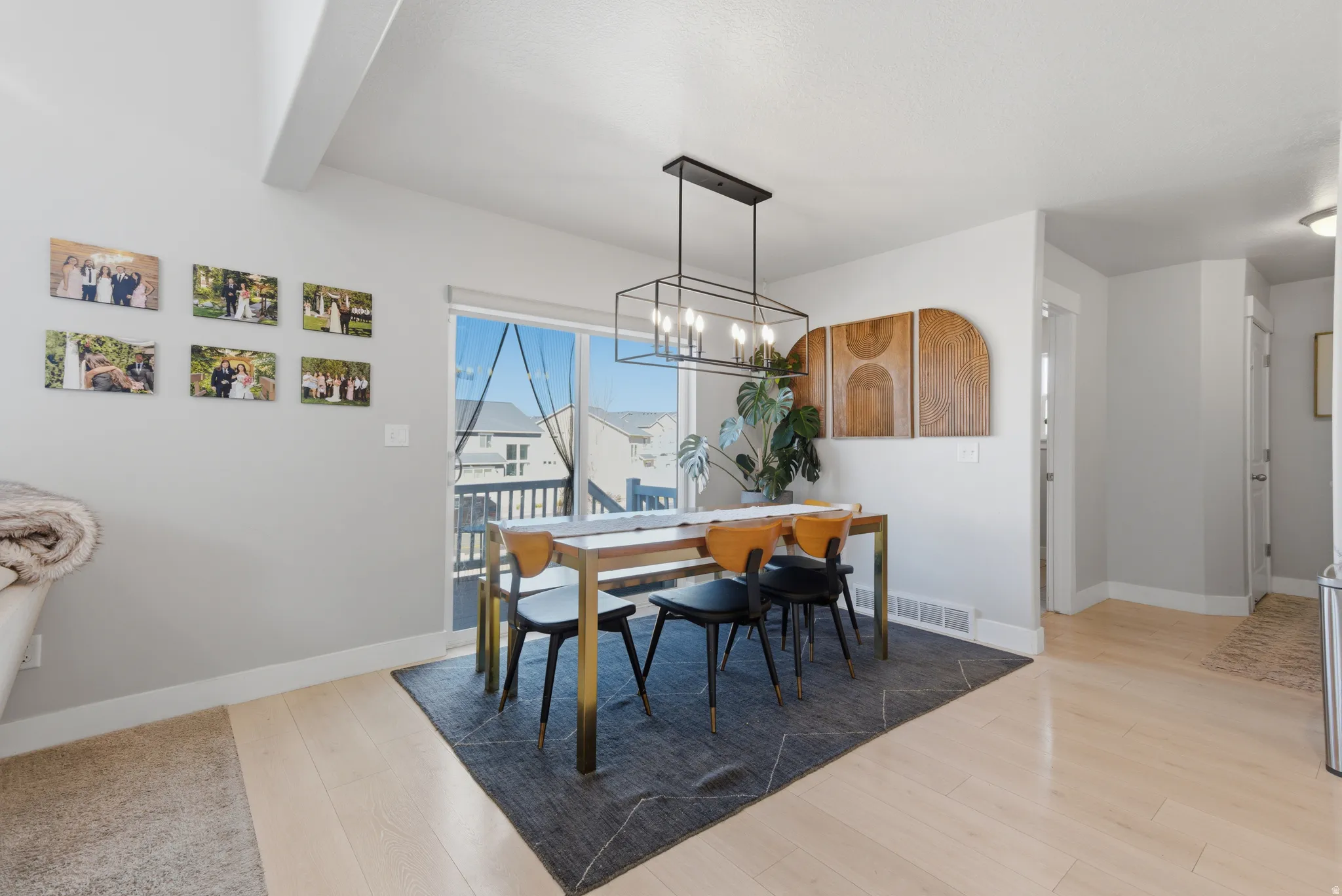 Dining space featuring light wood-style flooring and a chandelier