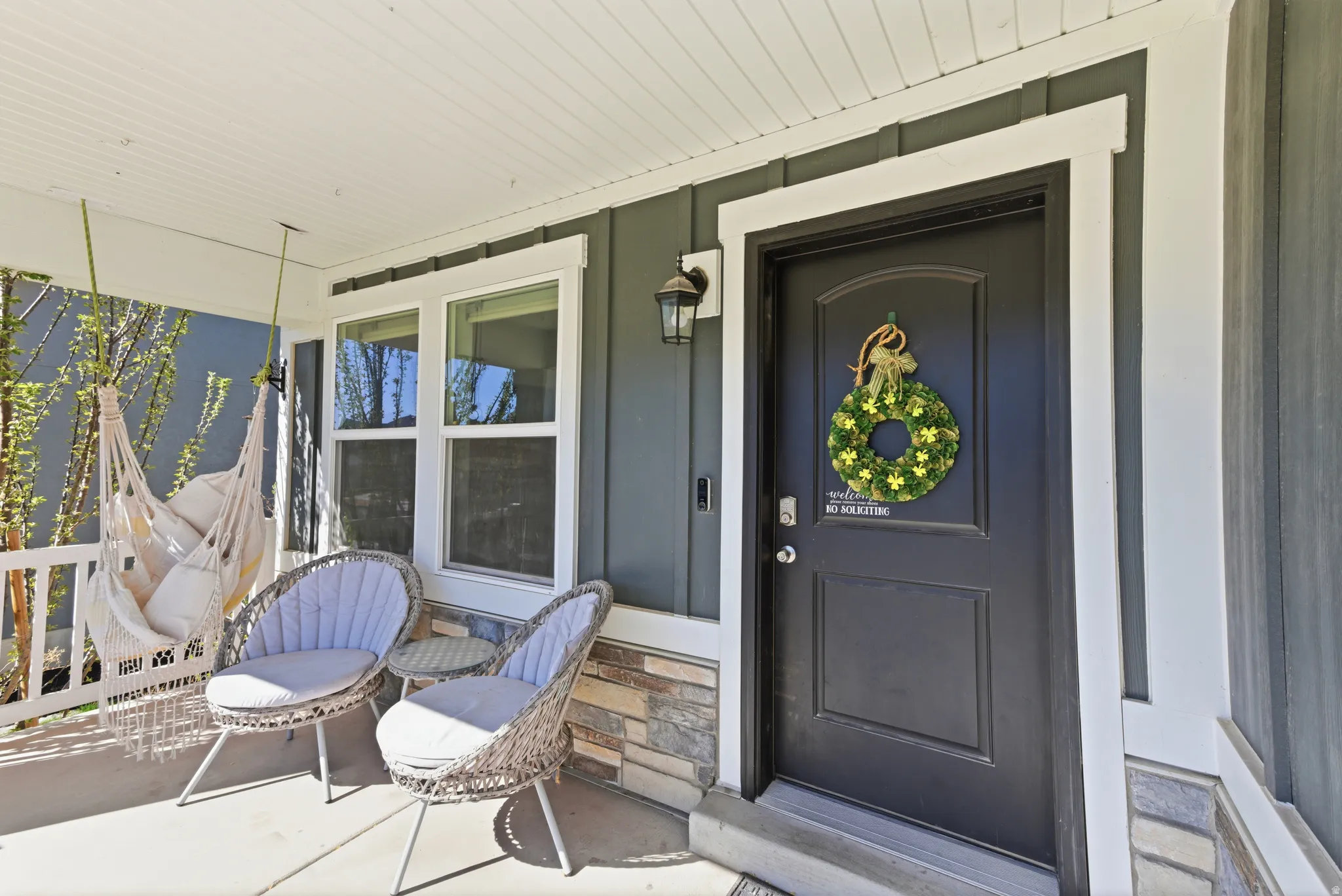 Doorway to property with covered porch