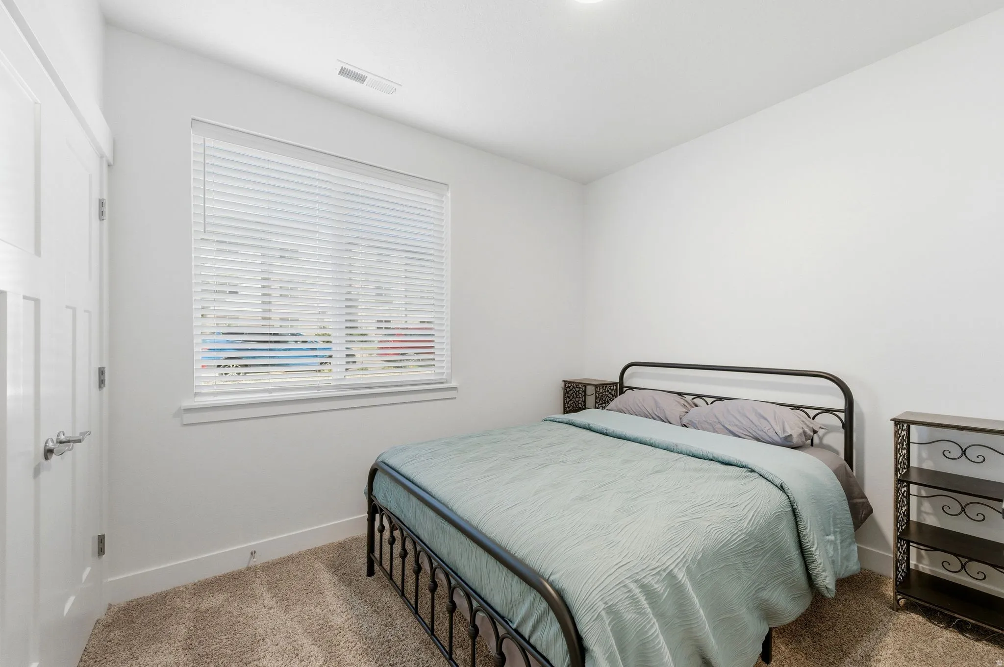 Bedroom with baseboards and carpet floors