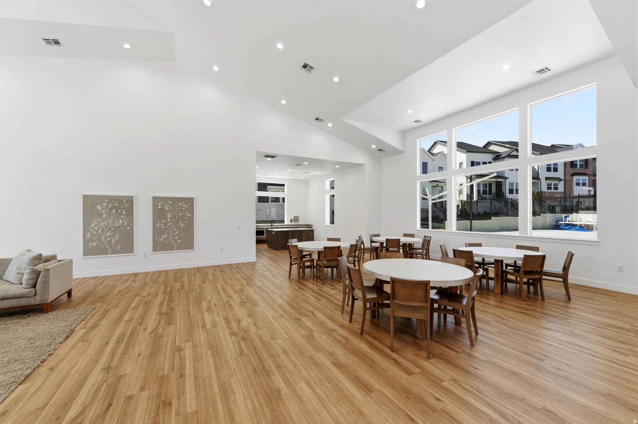 Dining space with light wood-style flooring, recessed lighting, and lofted ceiling