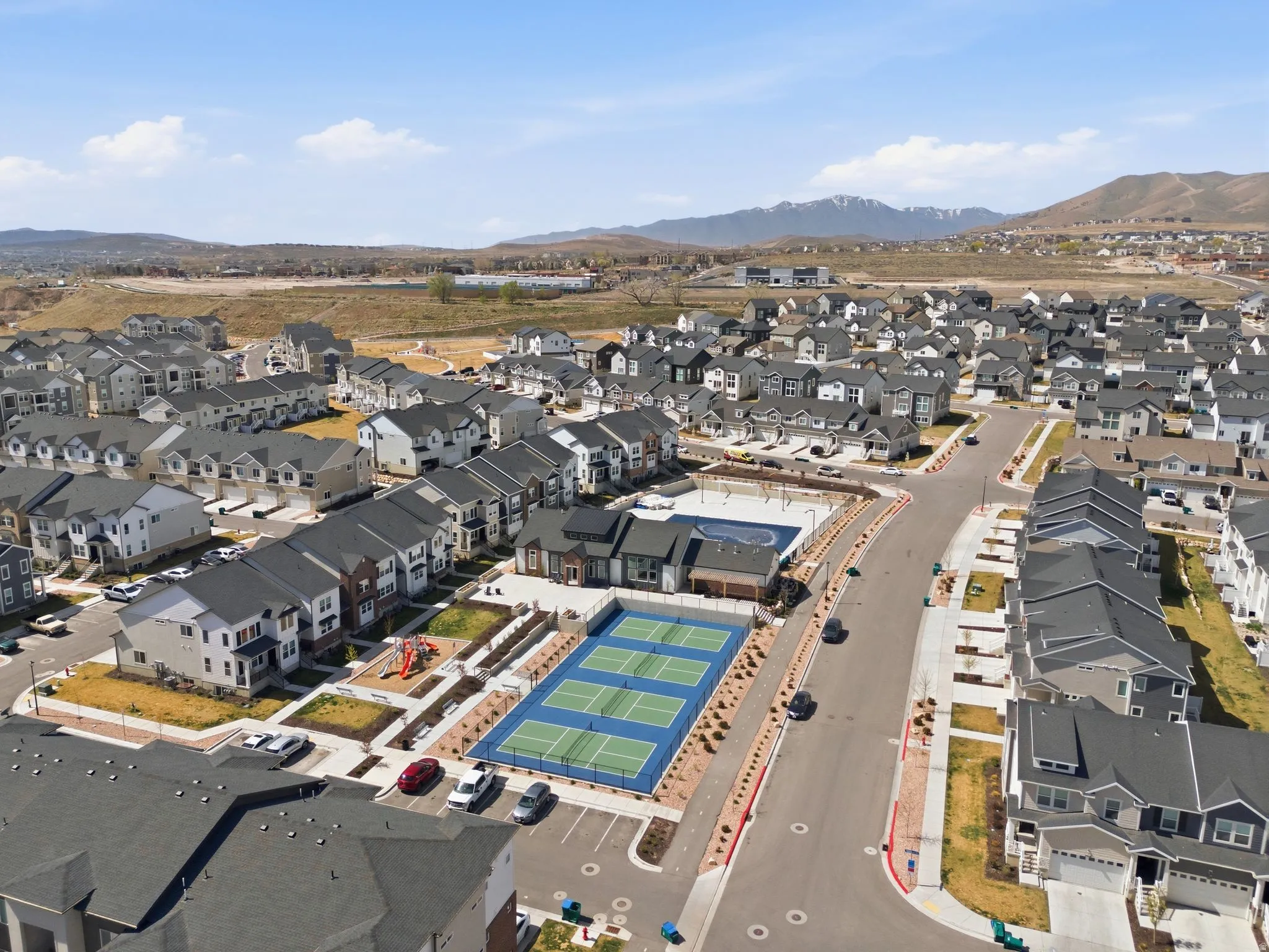 View of property location featuring nearby suburban area and a mountain backdrop