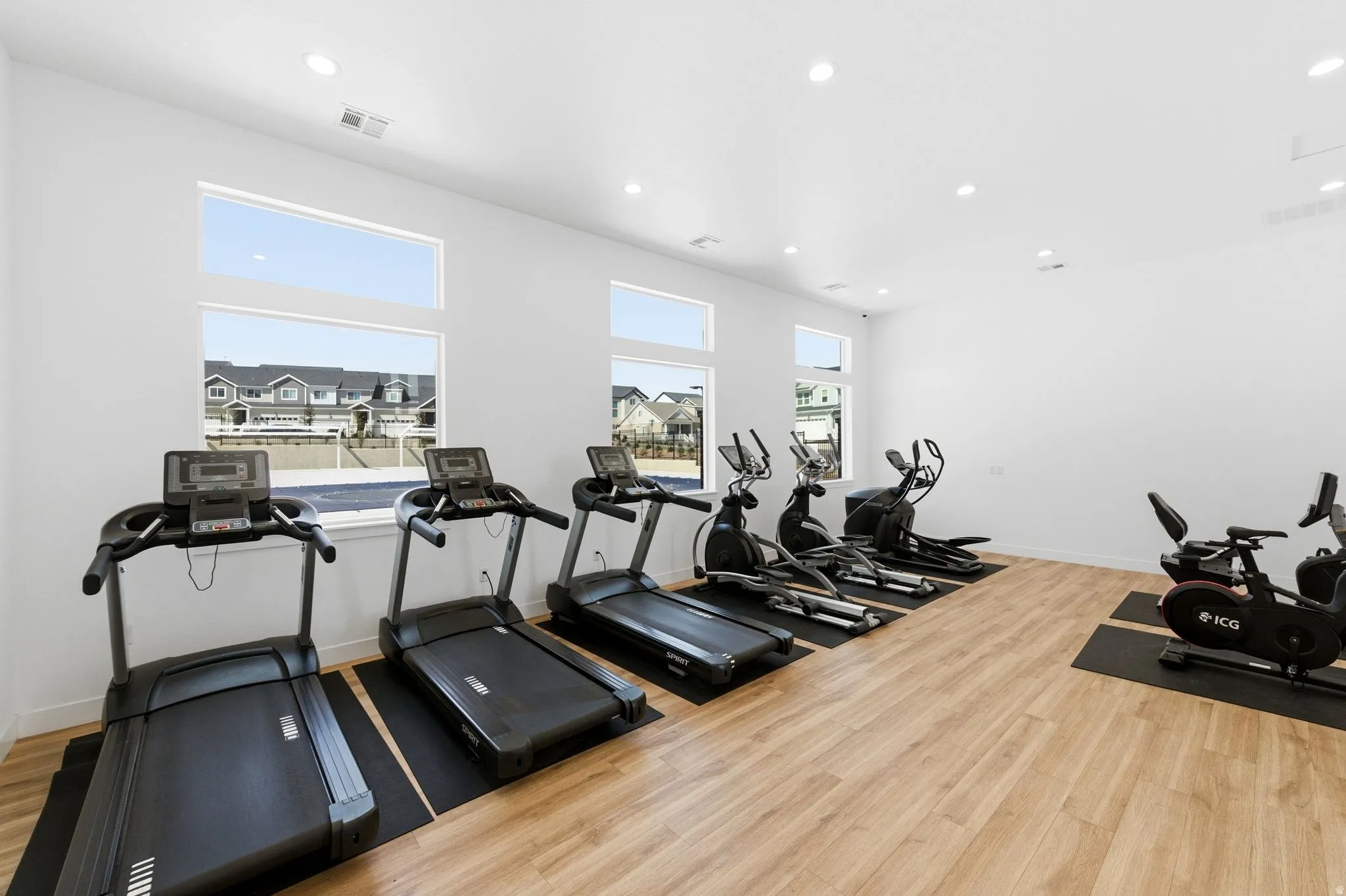 Workout area featuring recessed lighting