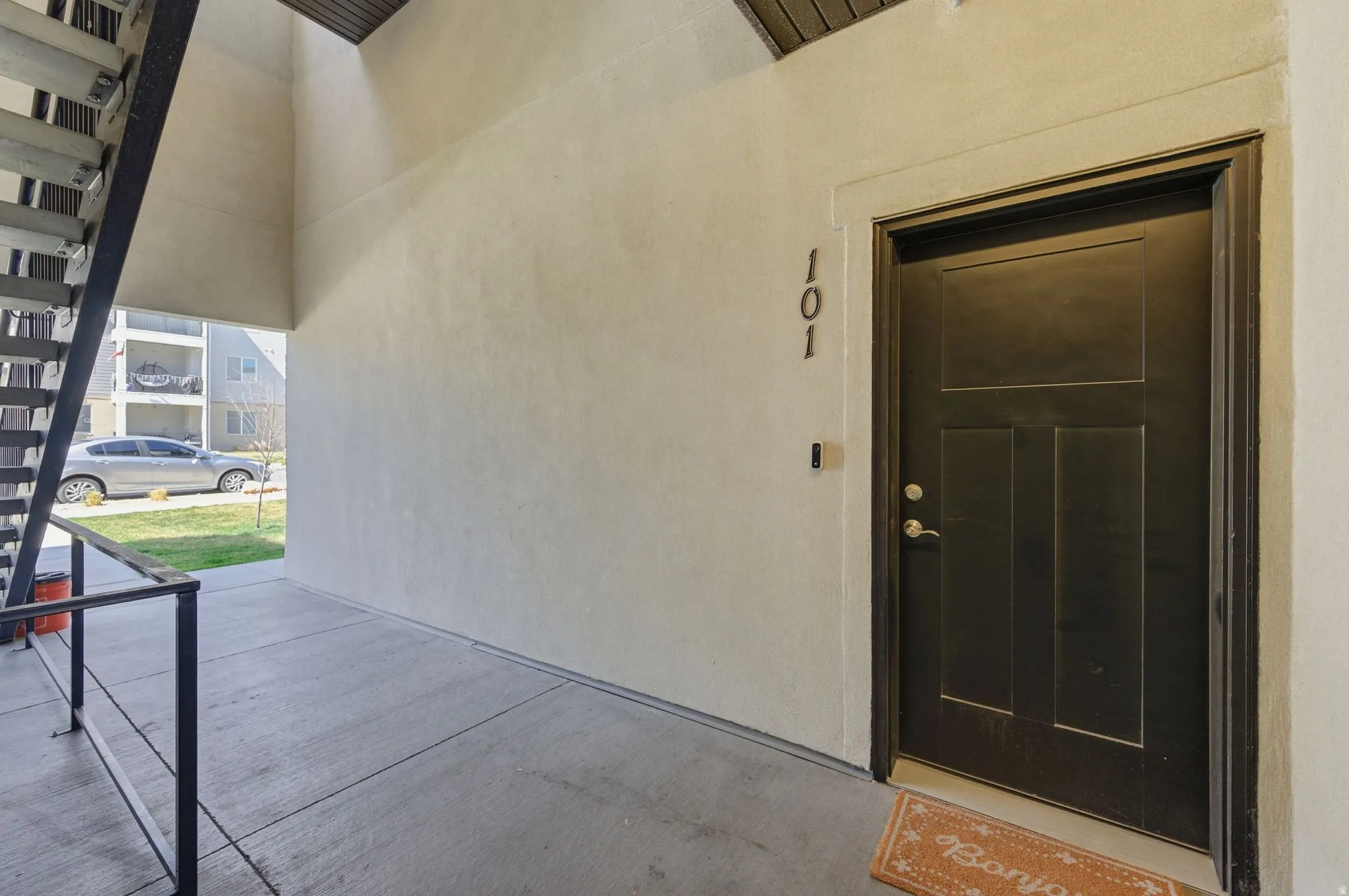 View of exterior entry with stucco siding