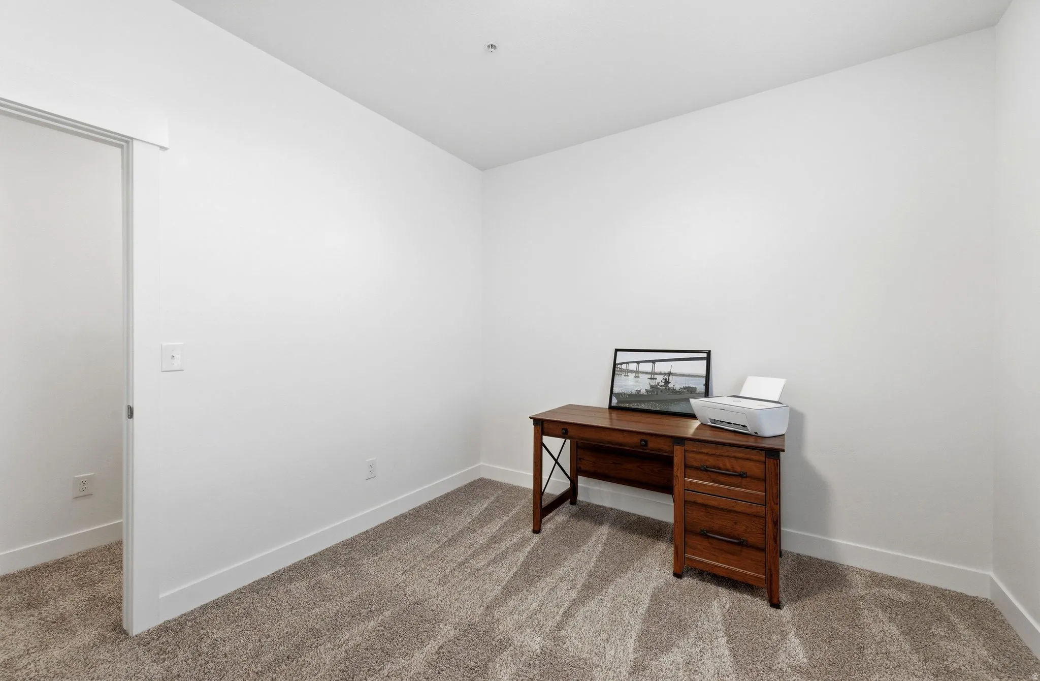 Office area featuring light colored carpet