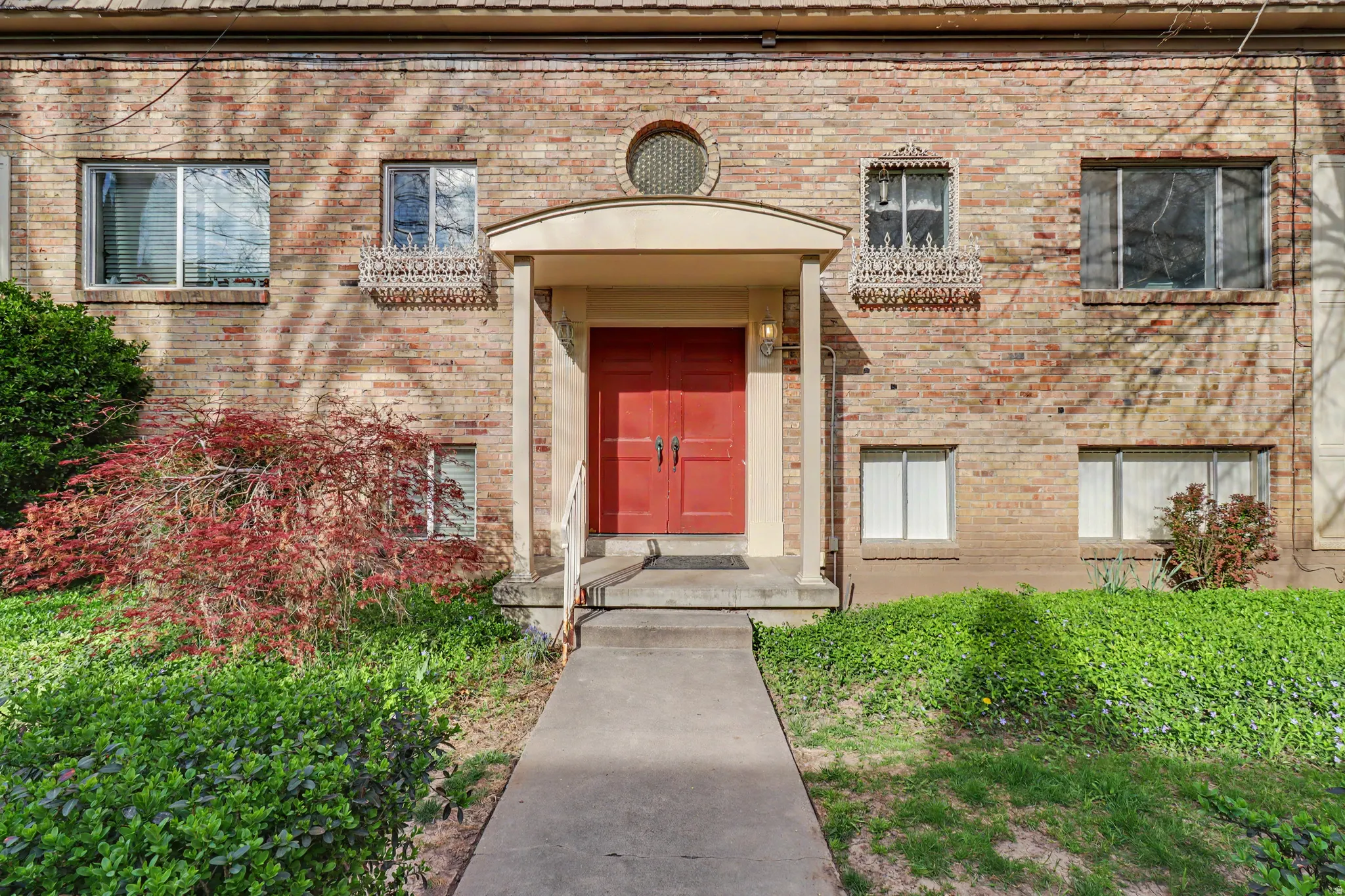 Doorway to property with brick siding