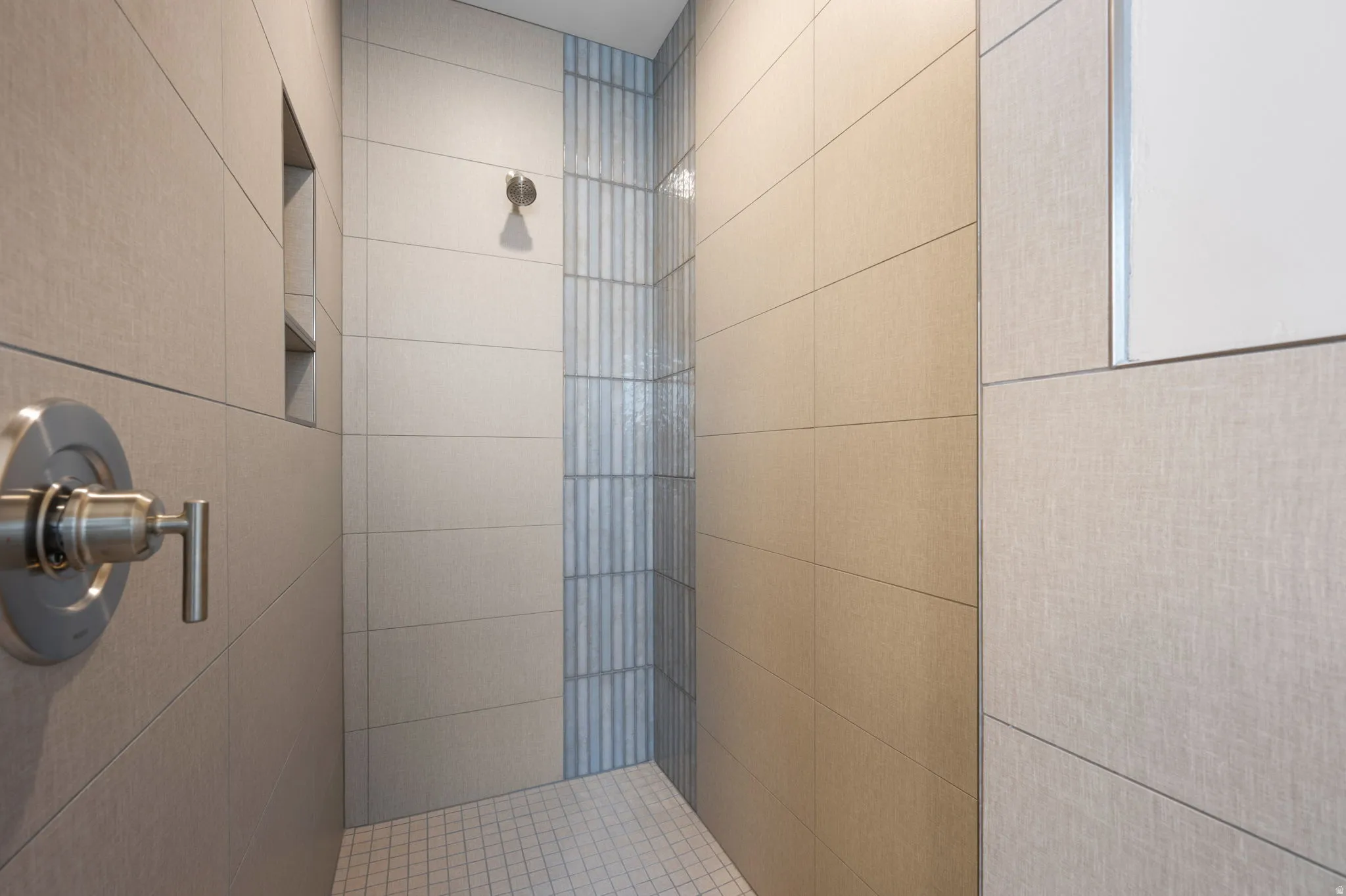 Bathroom featuring tiled shower