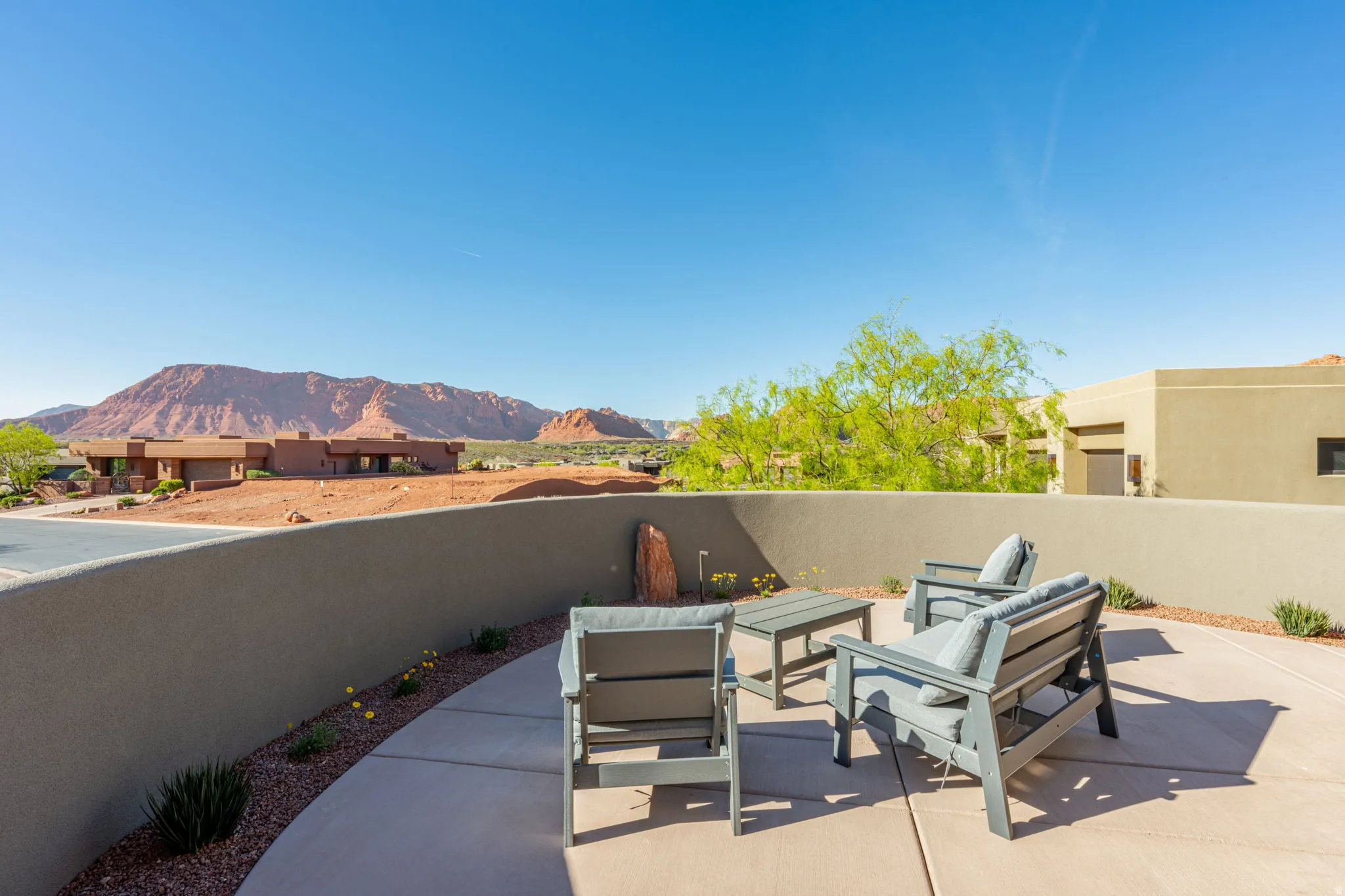 View of patio with outdoor seating and a mountain view
