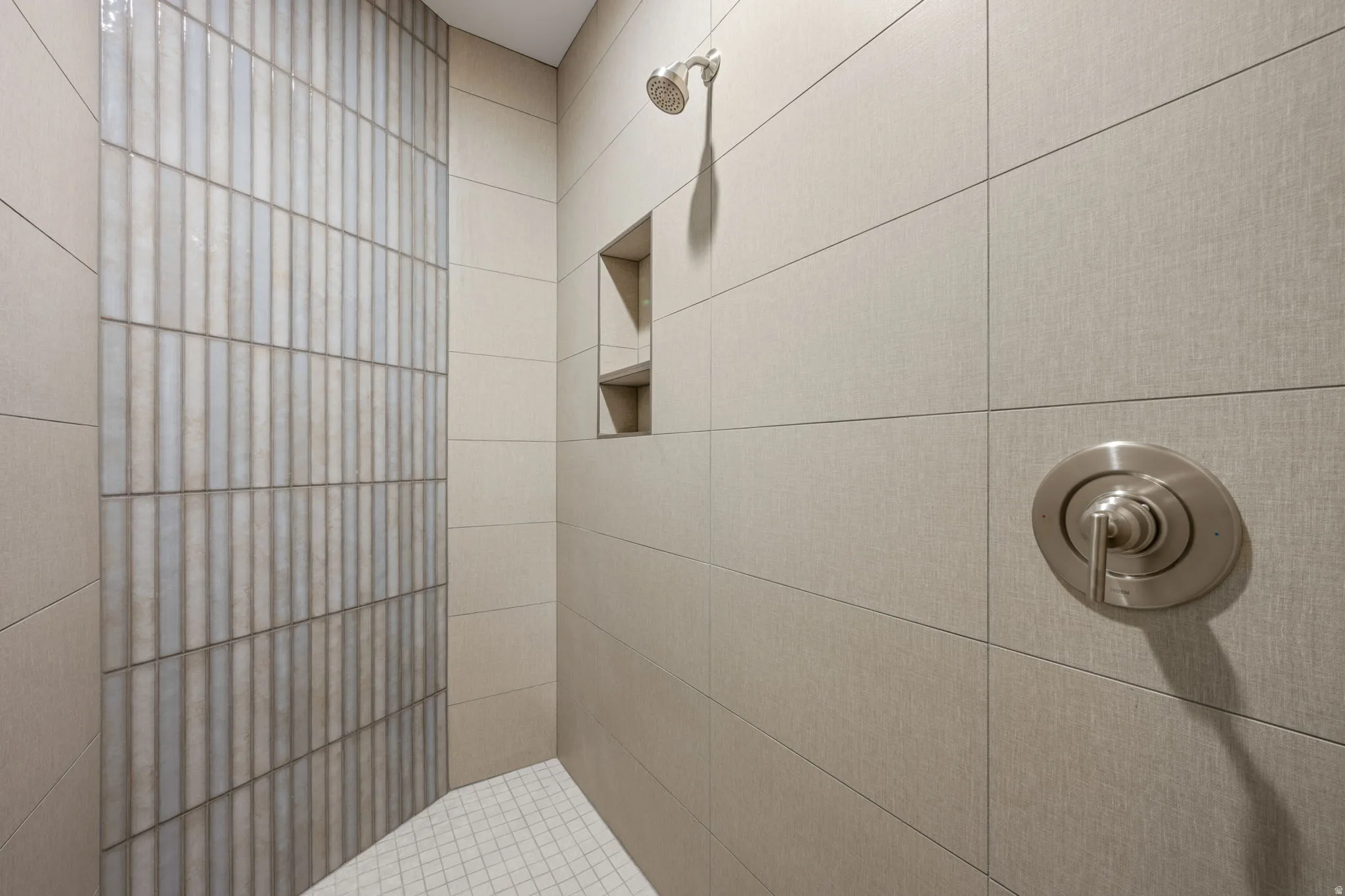 Full bath with a tile shower