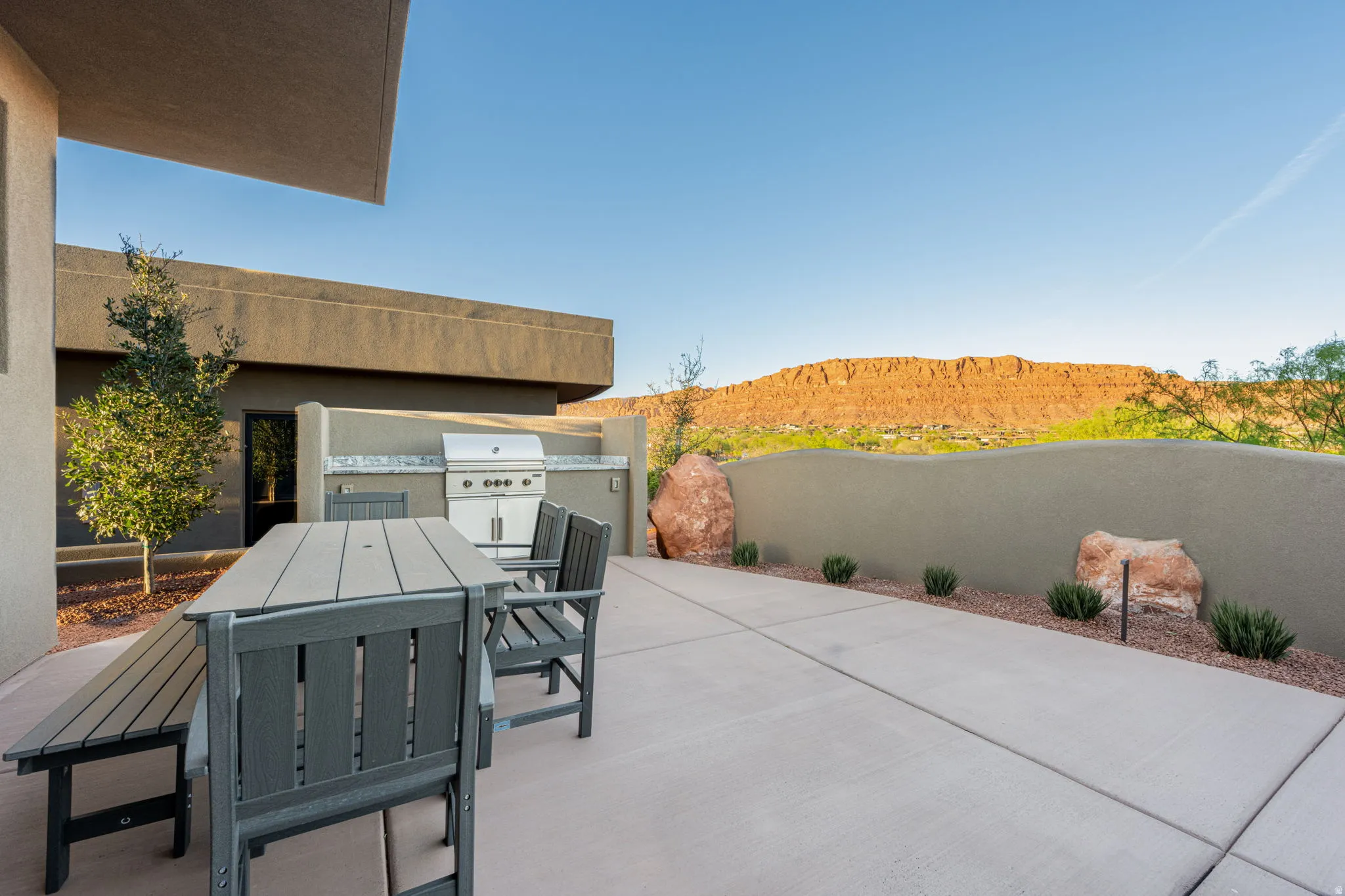 View of patio / terrace featuring outdoor dining space, a mountain view, and area for grilling