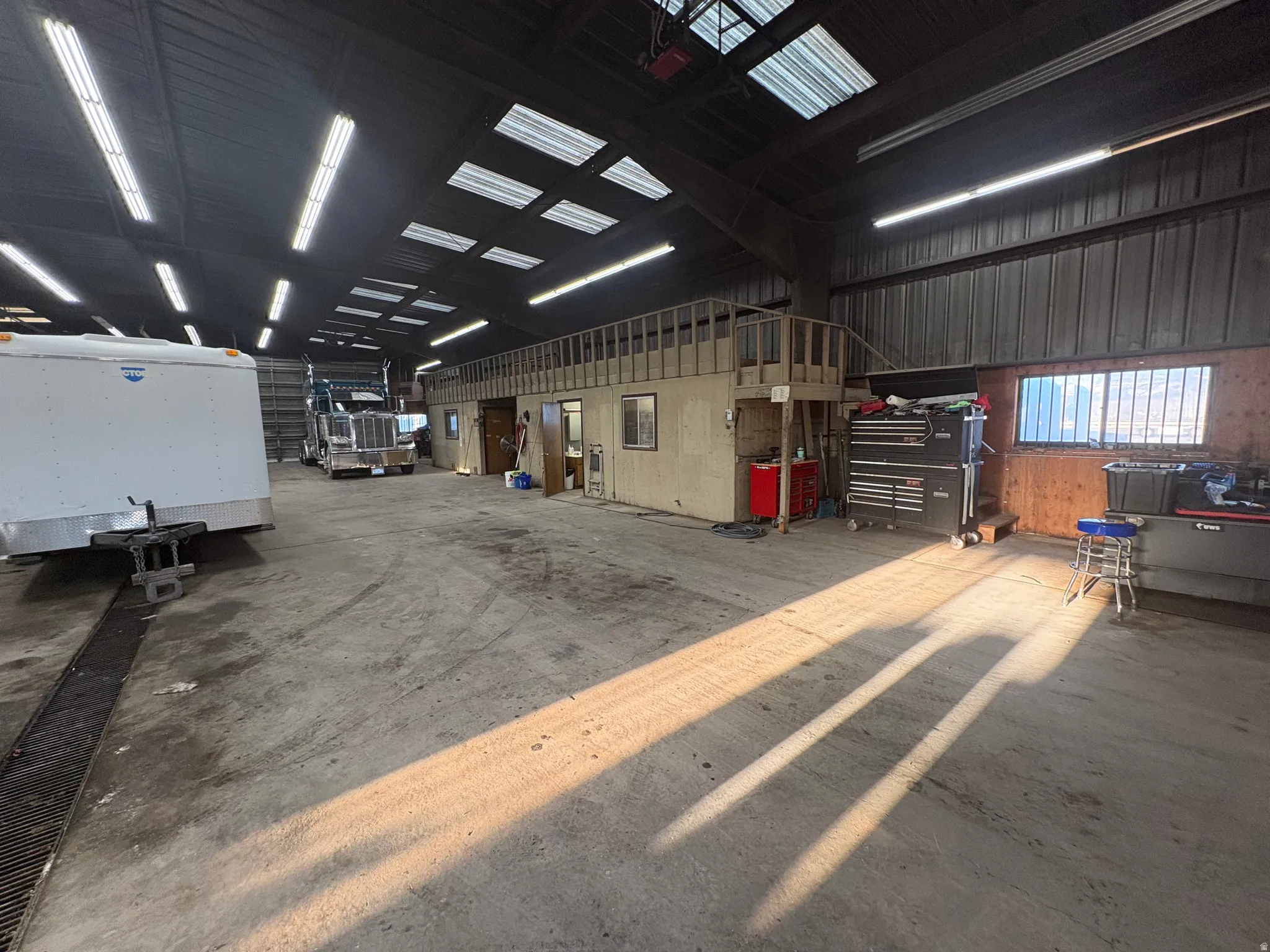 Miscellaneous room featuring a garage and metal wall