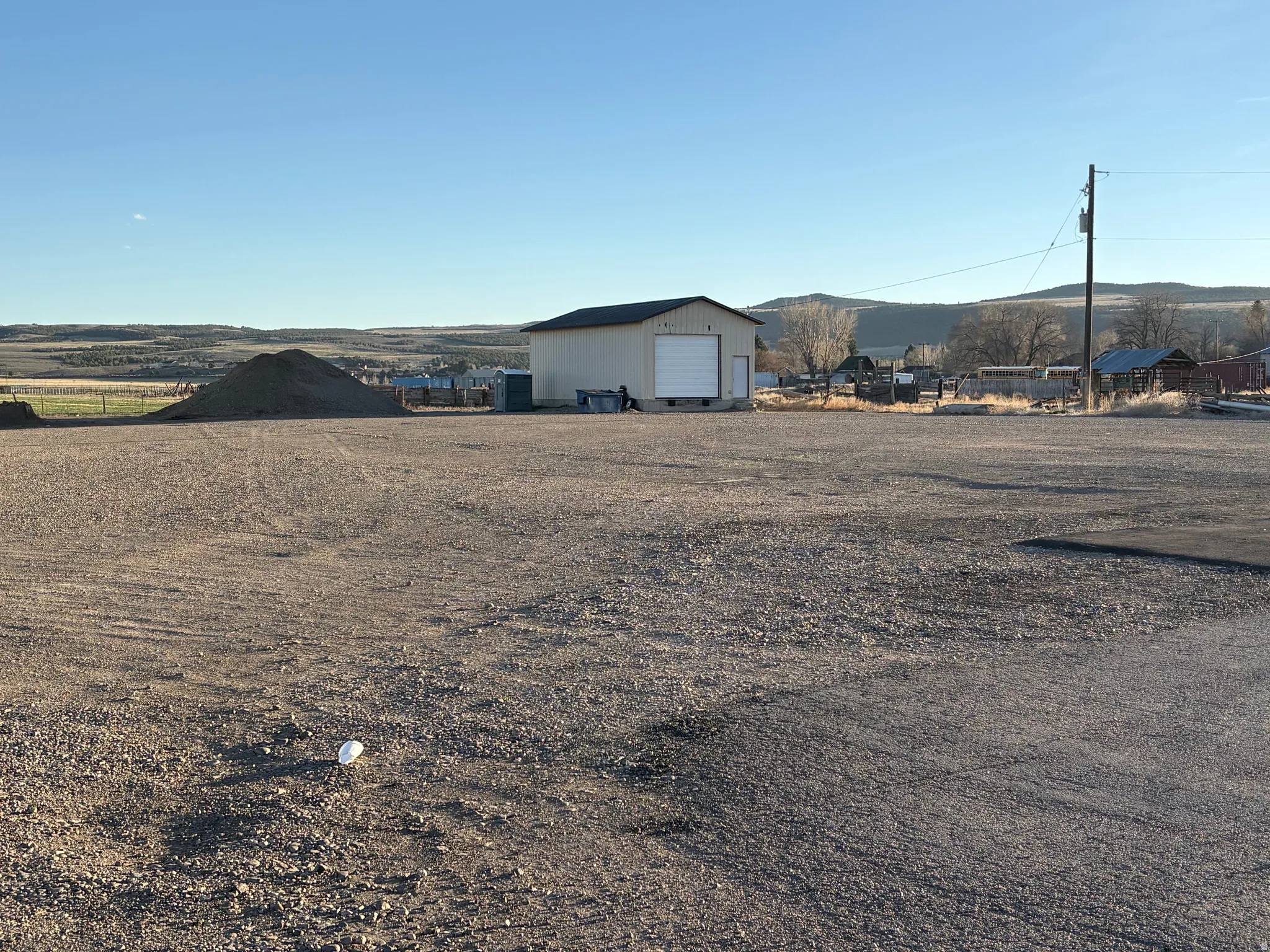 View of yard featuring an outbuilding and a garage