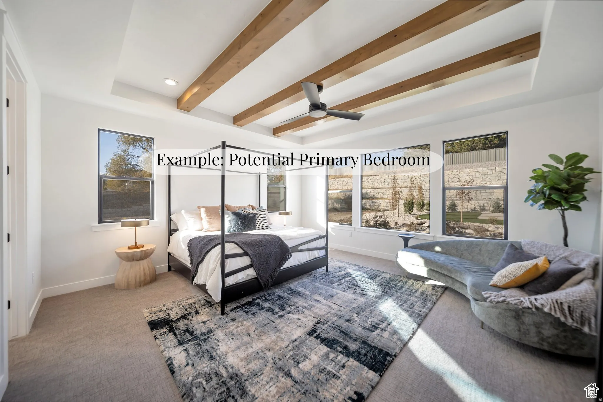 Bedroom with beamed ceiling, carpet, a raised ceiling, ceiling fan, and recessed lighting