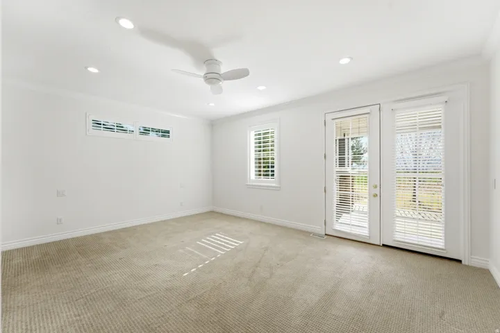 Primary Bedroom with private entrance to the enclosed patio.