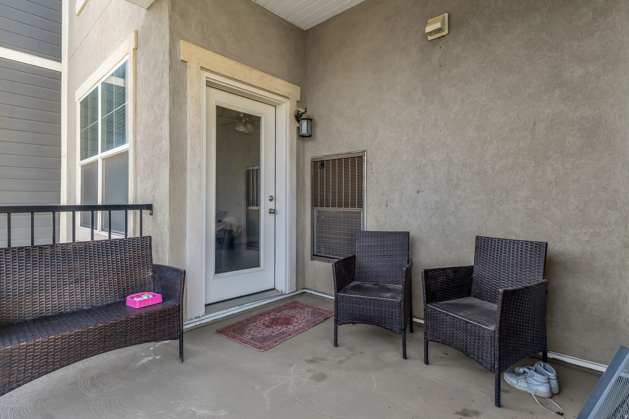 Property entrance with stucco siding