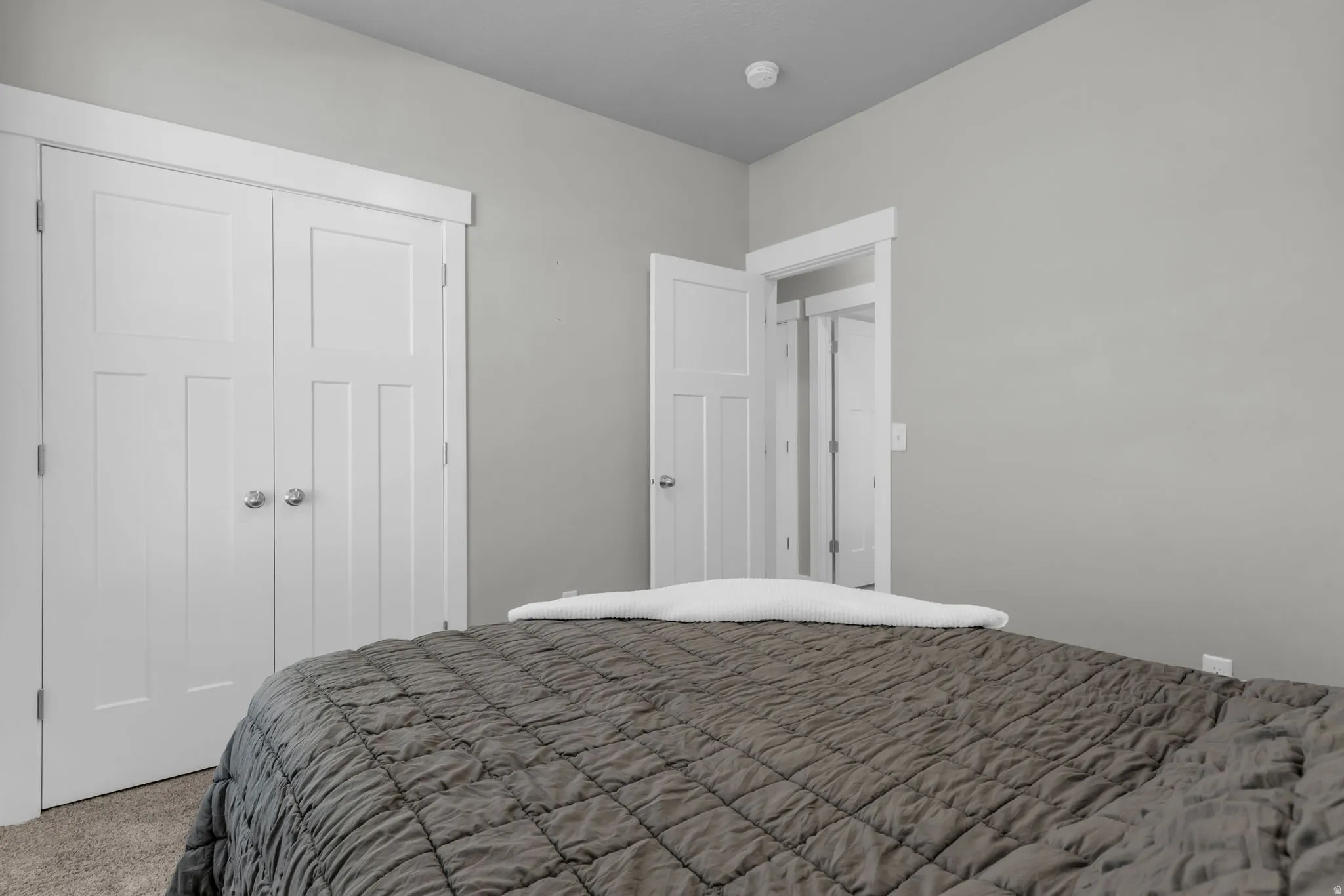 Bedroom with a closet and carpet flooring