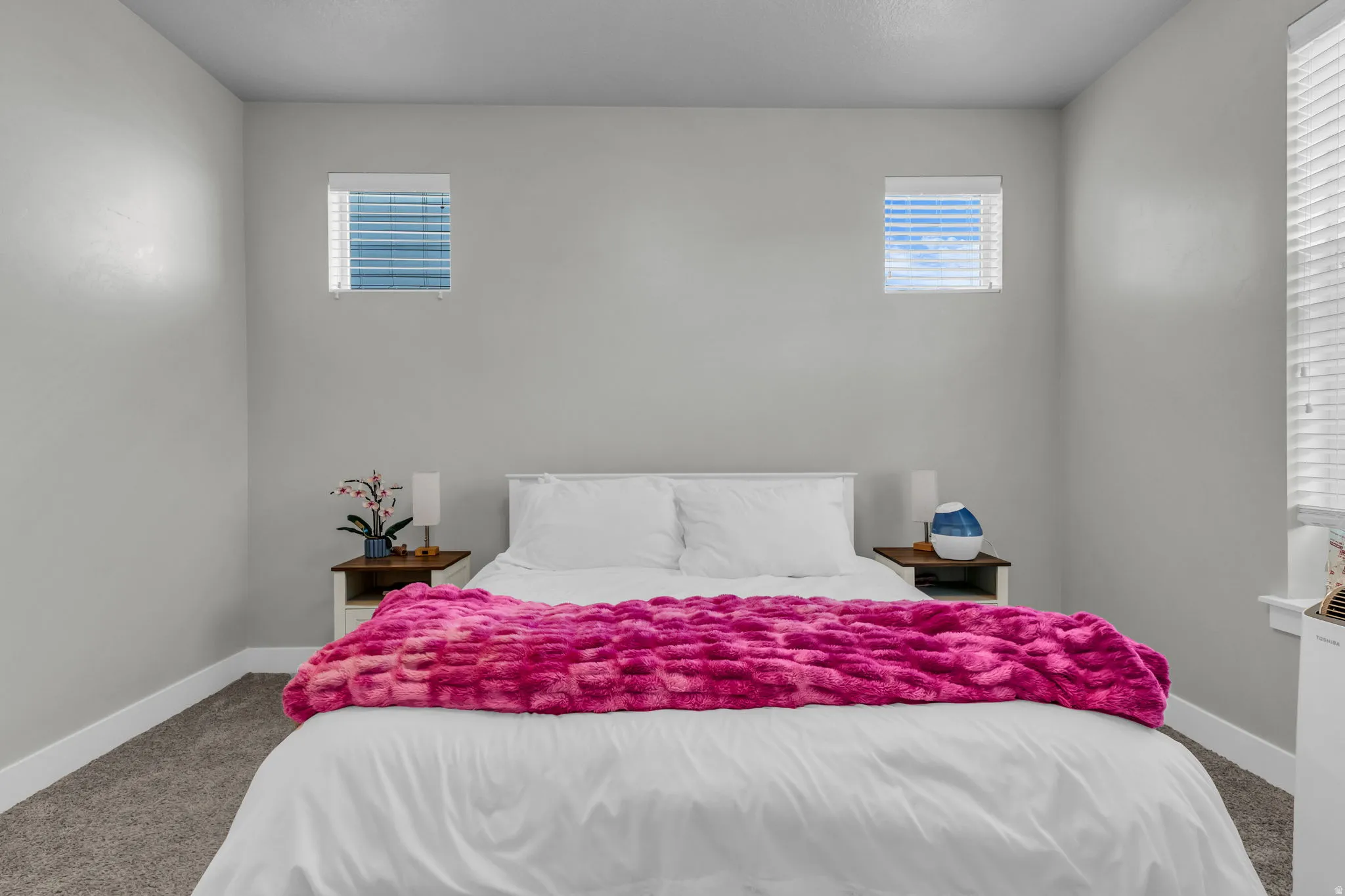 Carpeted bedroom with baseboards