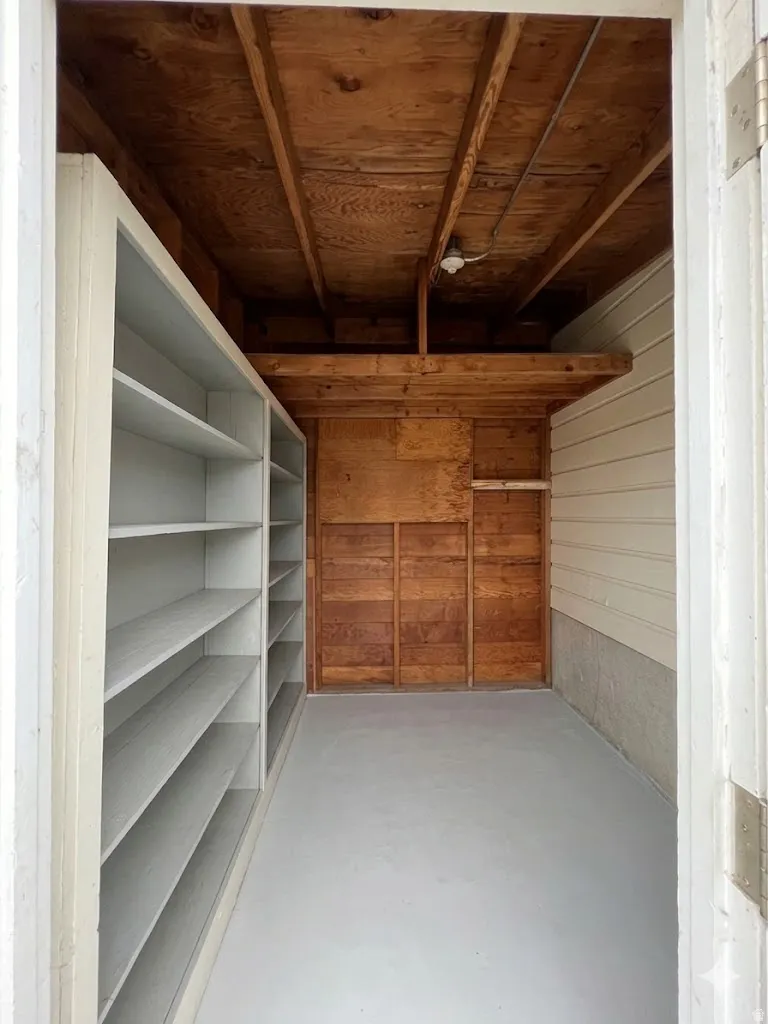 Approximate 9' by 9' attached storage shed behind patio.