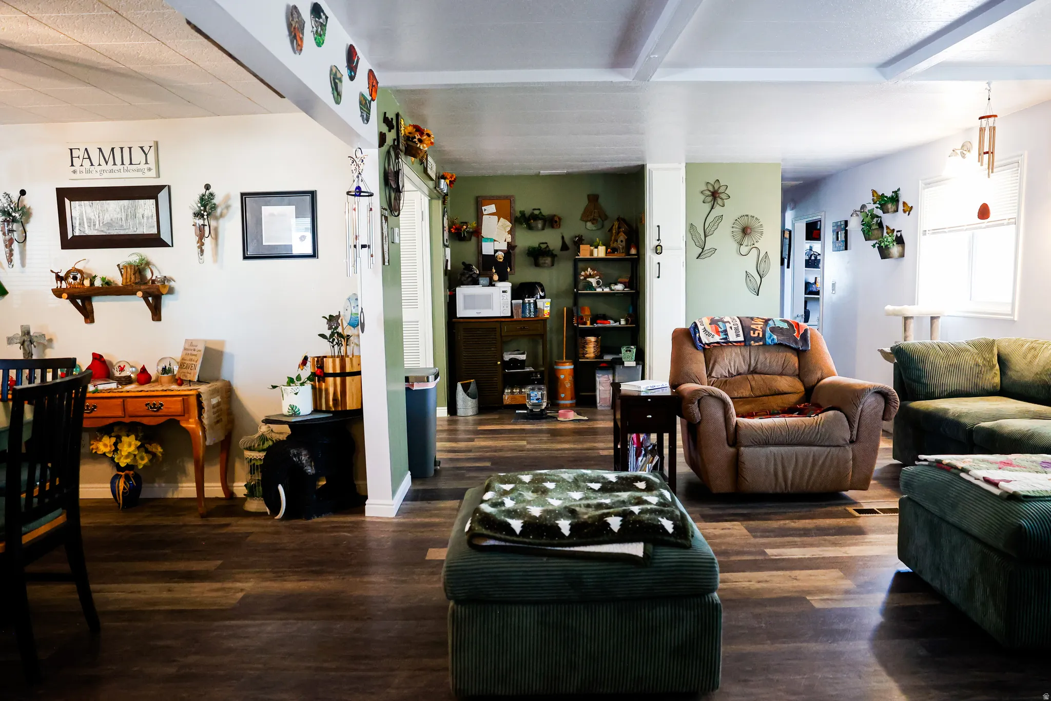 Living area featuring wood finished floors and baseboards