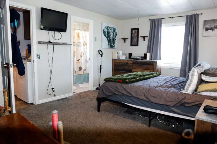 Bedroom with carpet floors and master bathroom