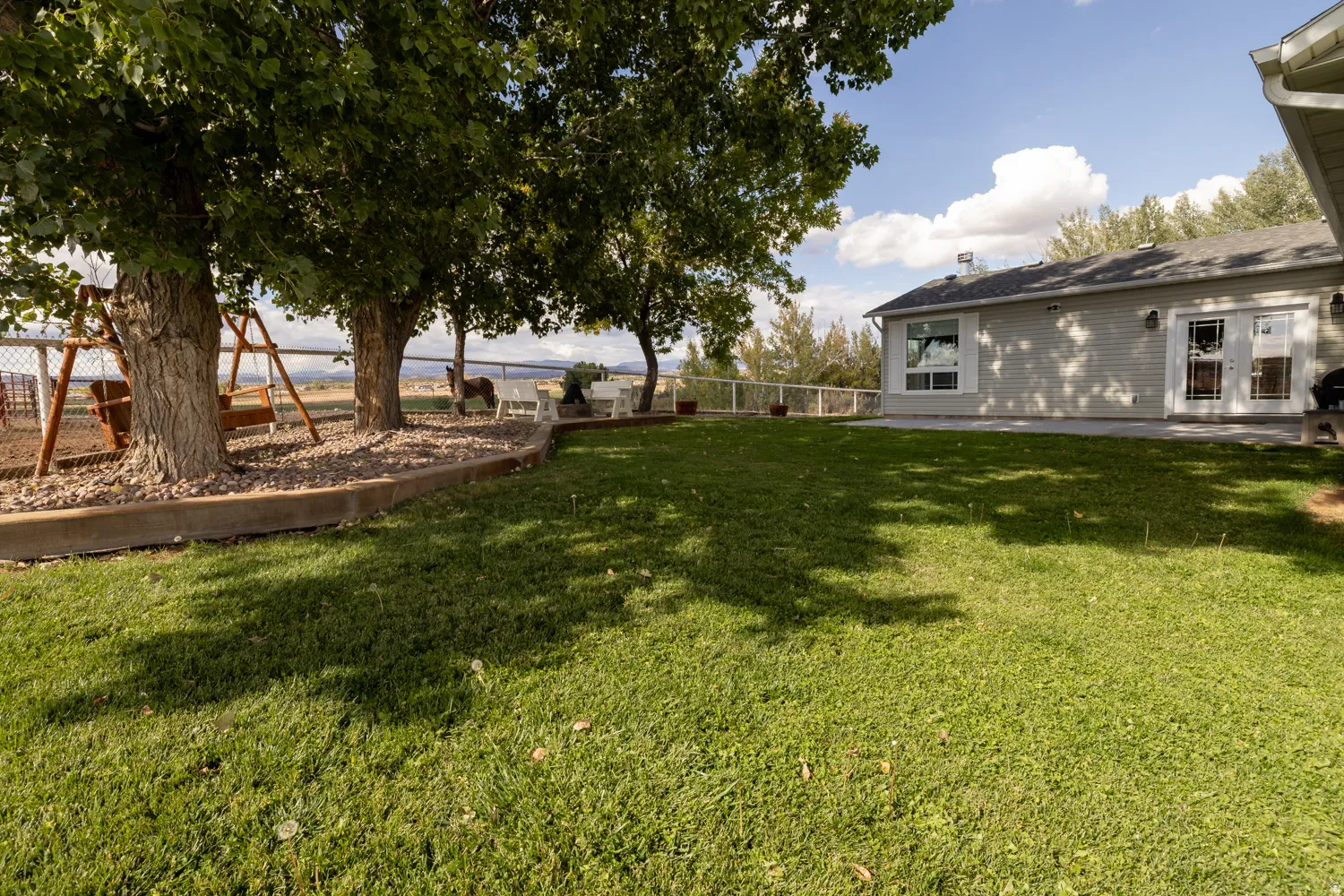 View of yard featuring a patio area and french doors