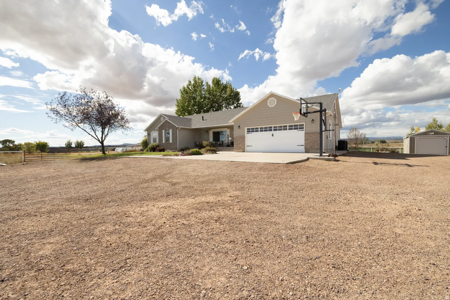 Ranch-style home featuring brick siding, concrete driveway, and a garage