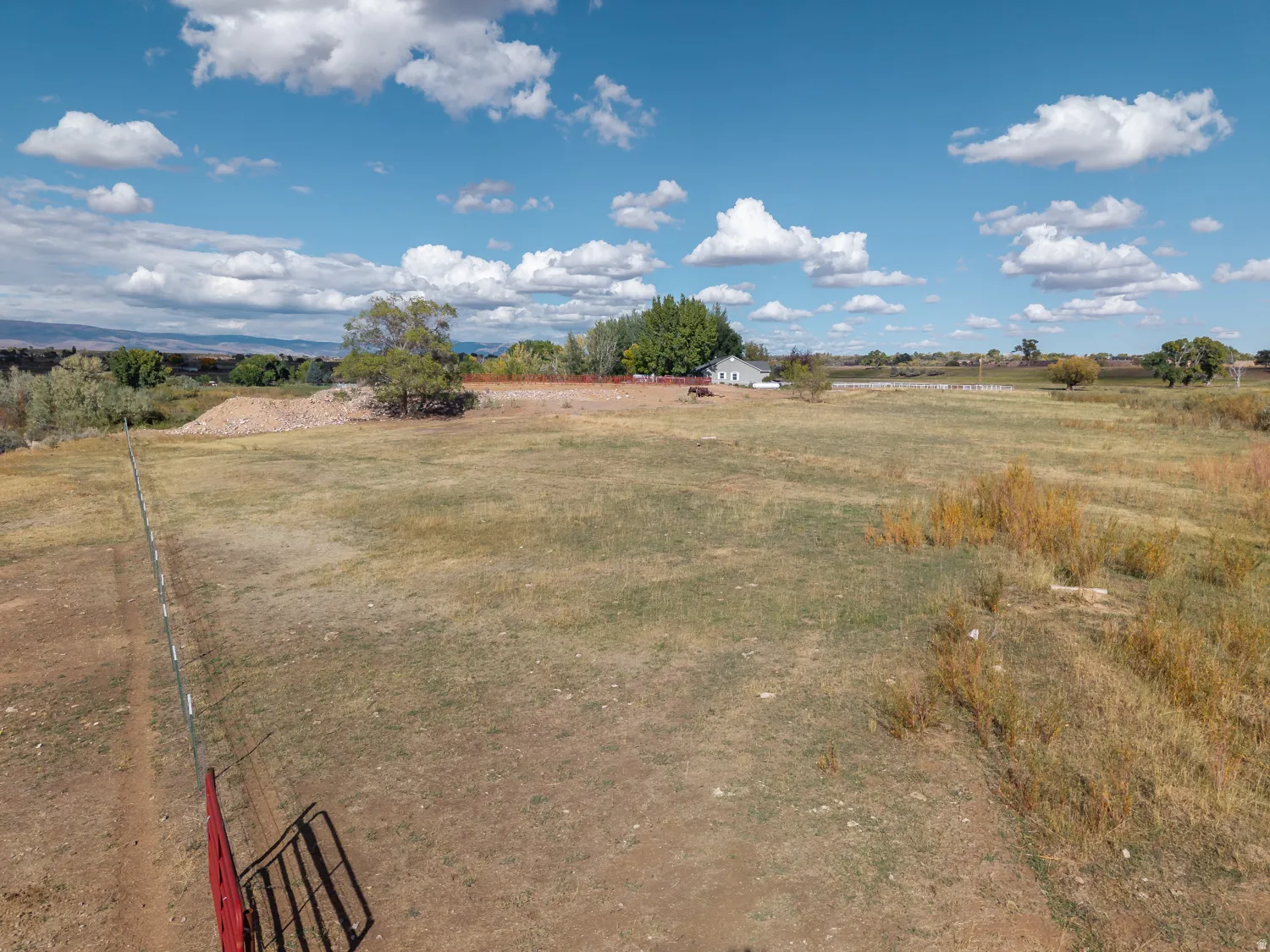View of yard with a rural view
